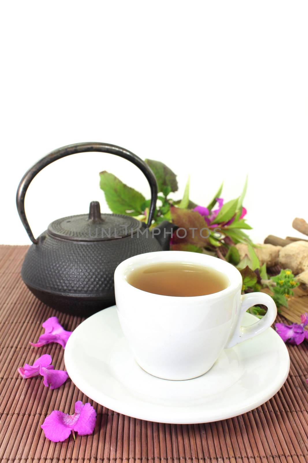 a cup of herbal tea and Chinese medicinal herbs