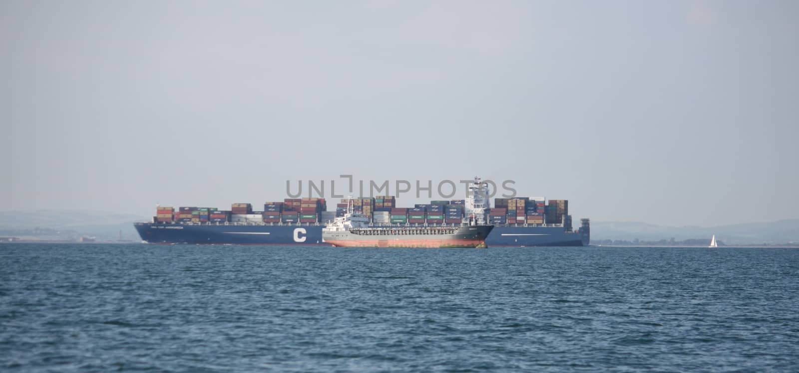 cargo ships passing at sea by chrisga