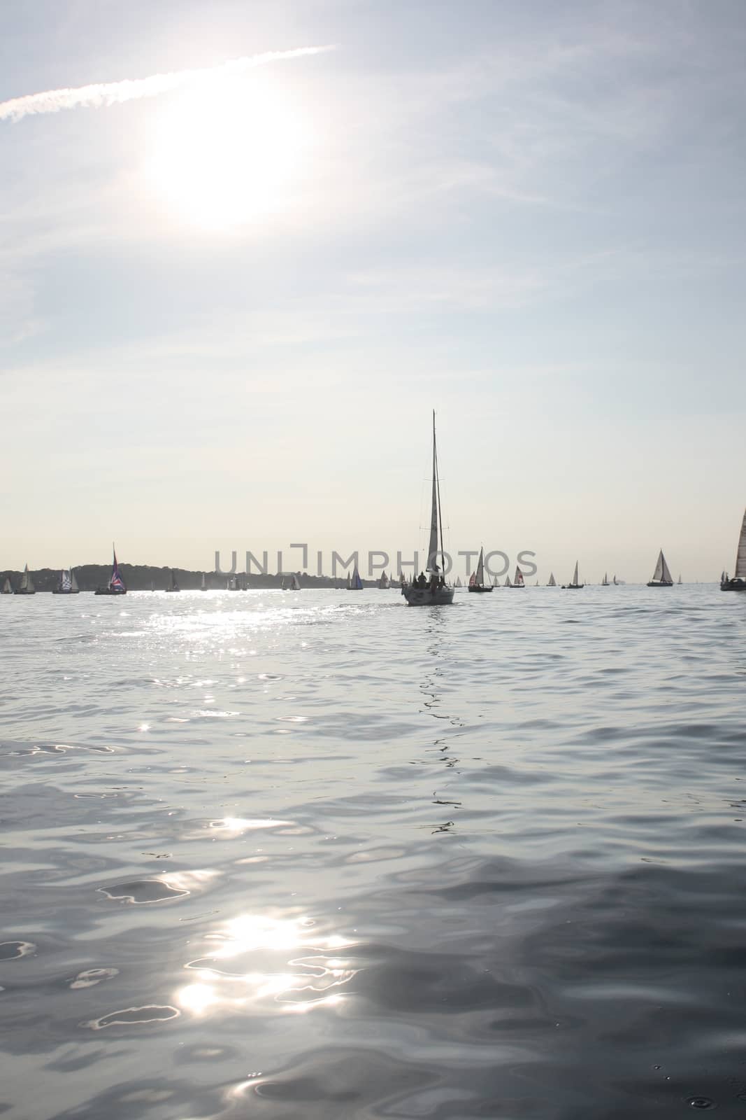 yacht sailboats sailing on a calm sunny day on the solent by chrisga