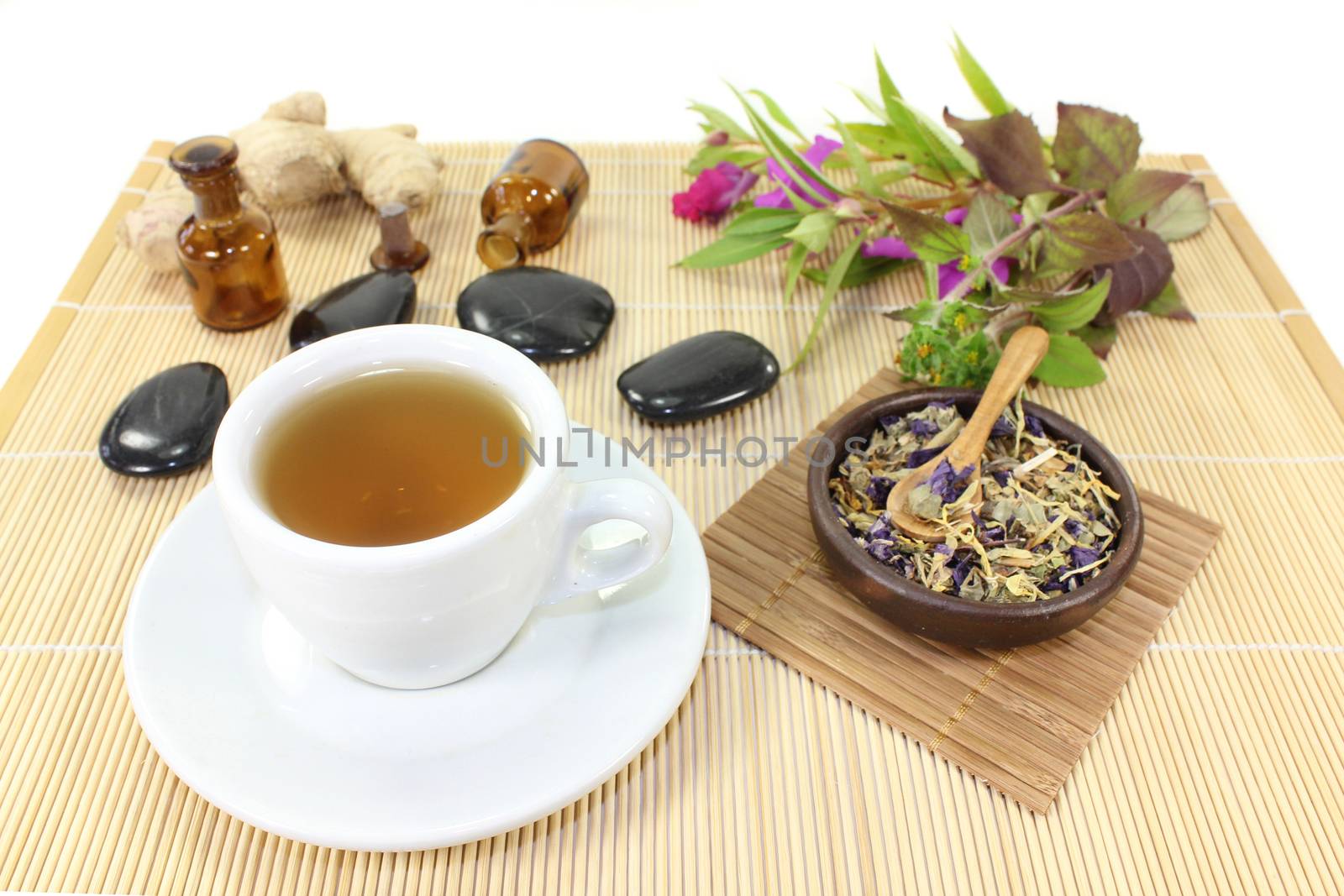 a cup of herbal tea and Chinese medicinal herbs