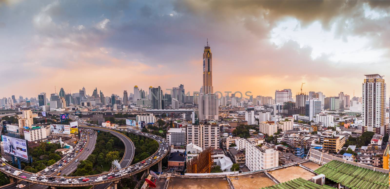 An aerial view of Bangkok city and transportation at evening sunshine