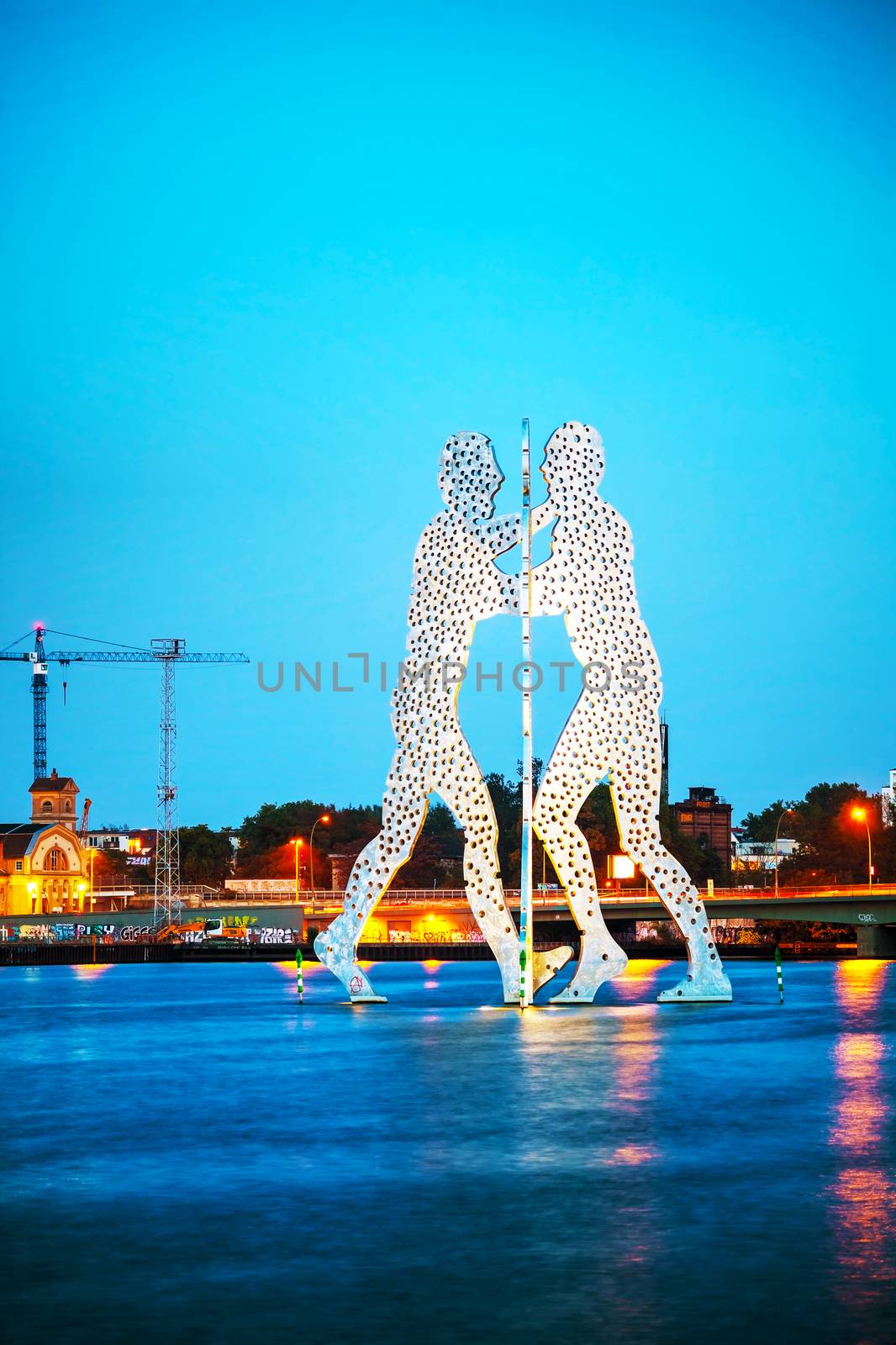 BERLIN - OCTOBER 4, 2014: Molecul Man sculpture on October 4, 2014 in Berlin, Germany. It's one in a series of aluminium sculptures, designed by American artist Jonathan Borofsky, installed at various locations in the world, including Berlin.