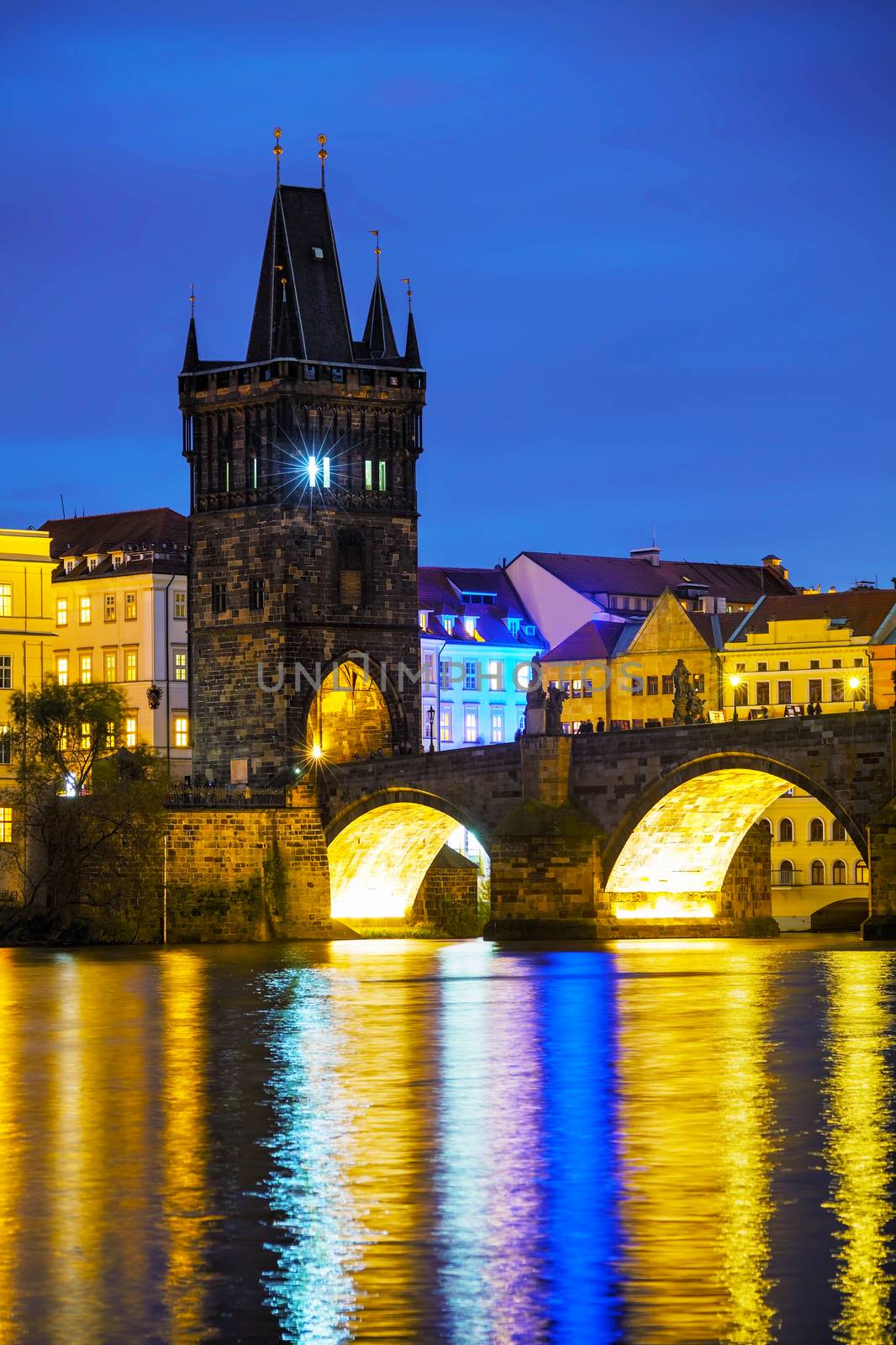 The Old Town Charles bridge tower in Prague in the evening