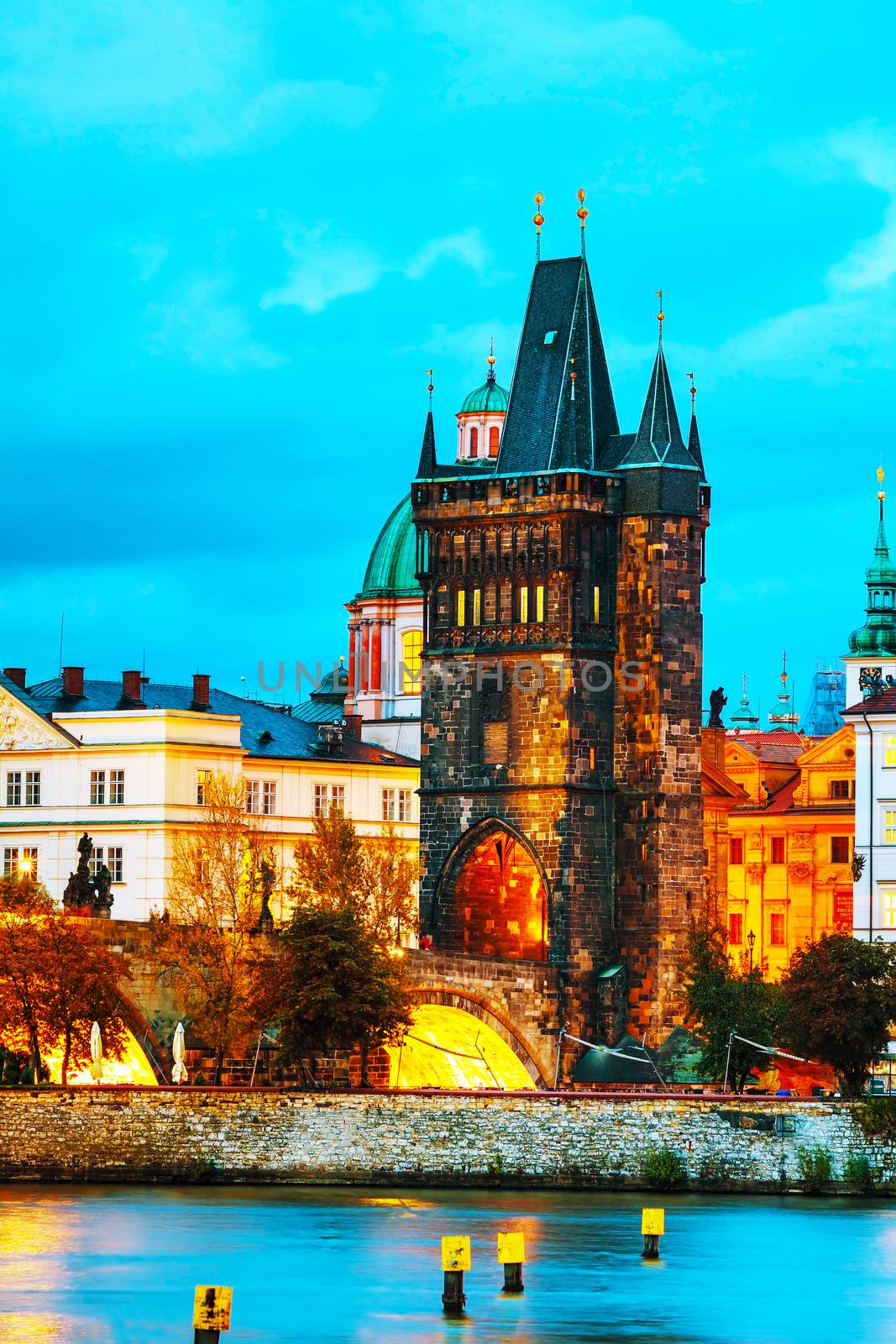 The Old Town Charles bridge tower in Prague in the evening