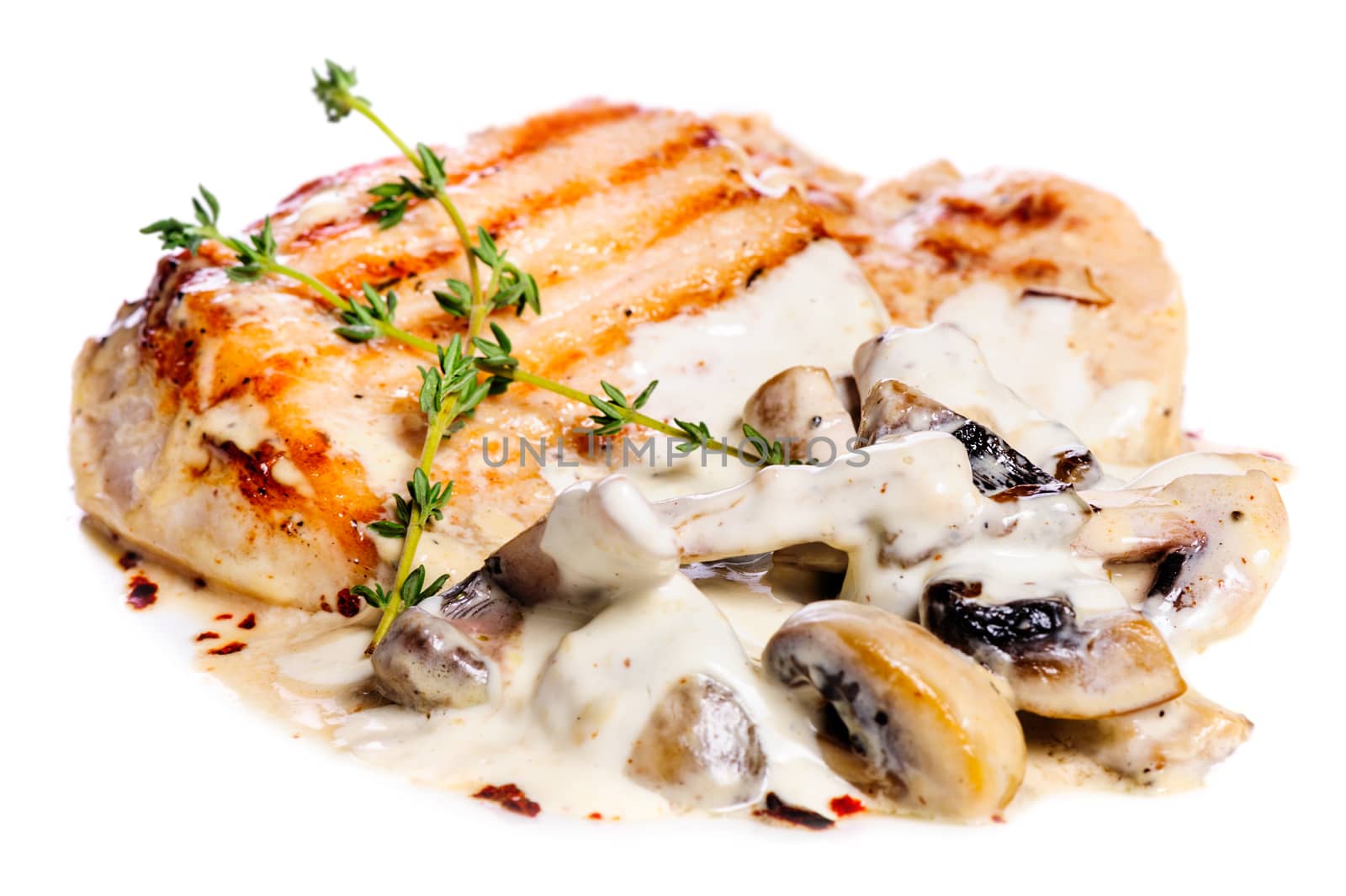 Light grilled pork escalope with mushrooms in white sauce and rosemary
