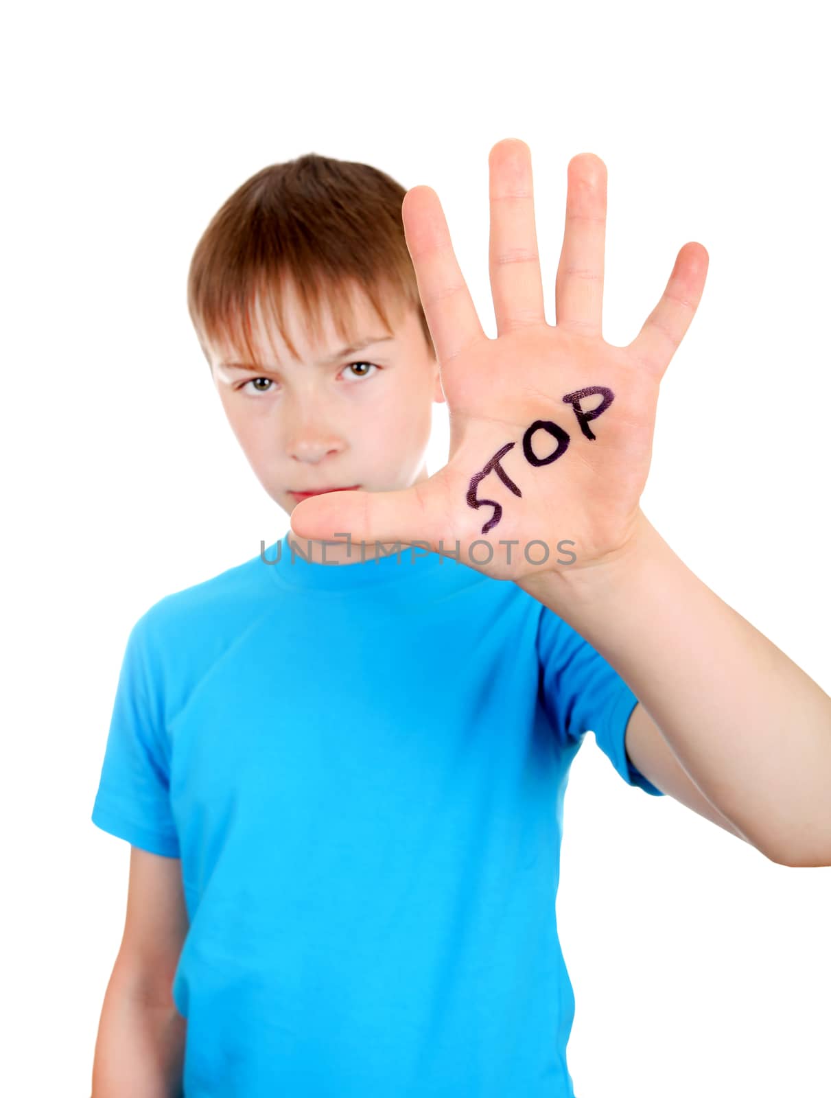 Focus on the Palm. Kid shows the palm gesture with an inscription STOP