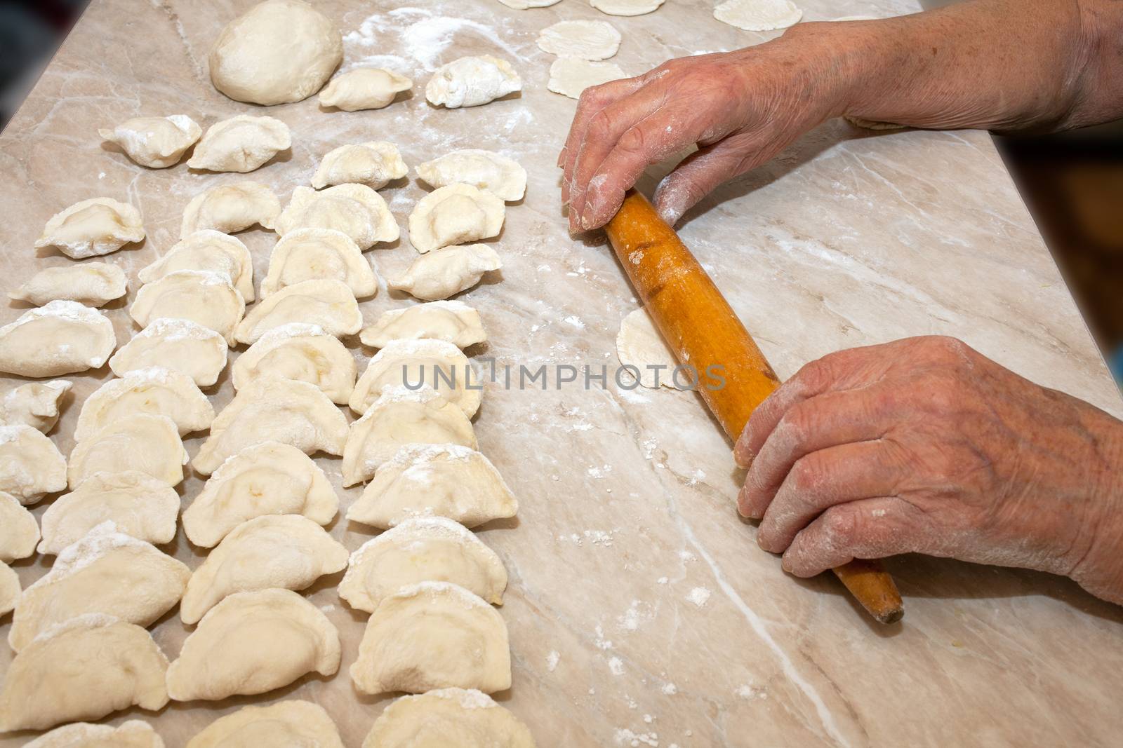A fragment of the manufacturing process dumplings at home on the kitchen table