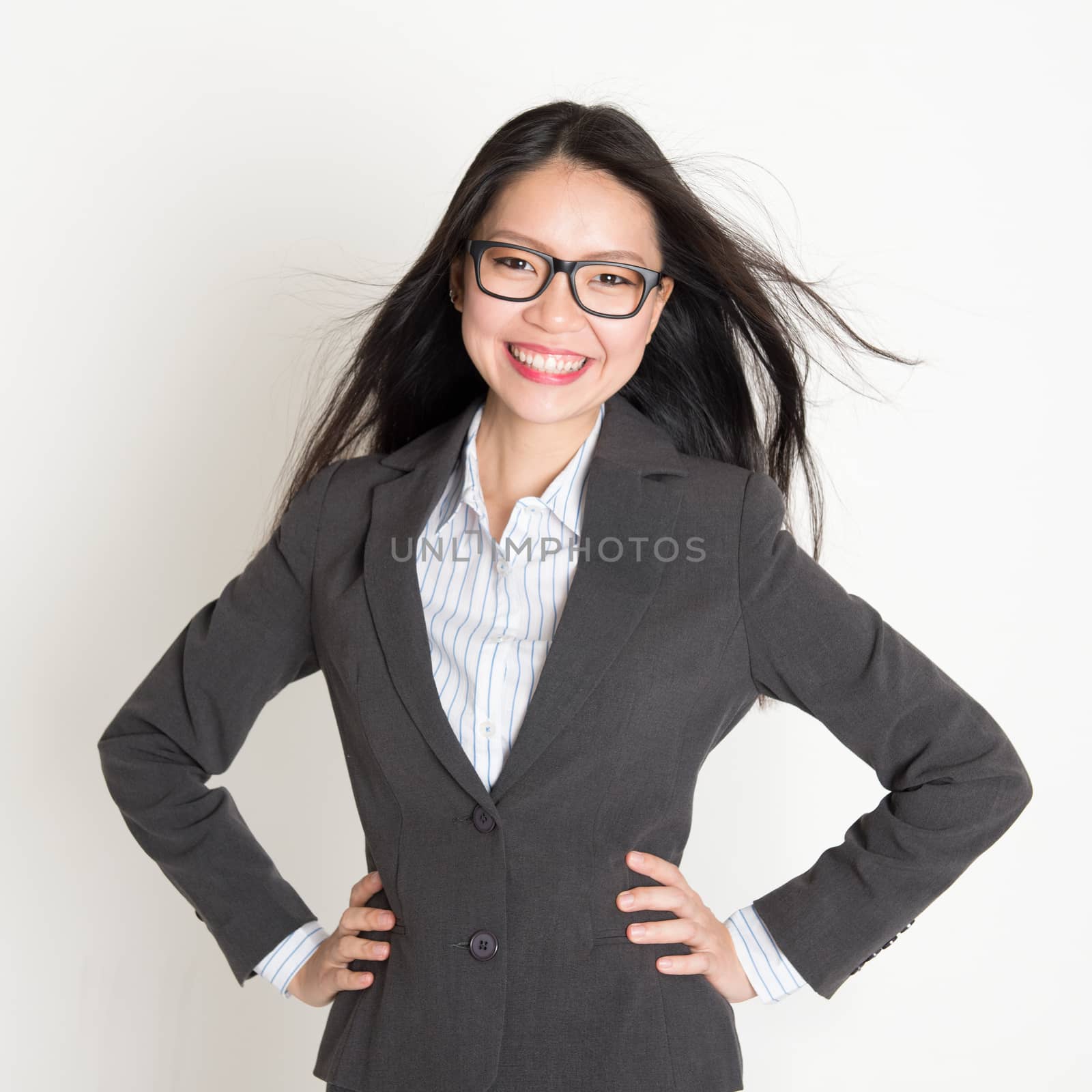 Confident young Asian business woman  by szefei