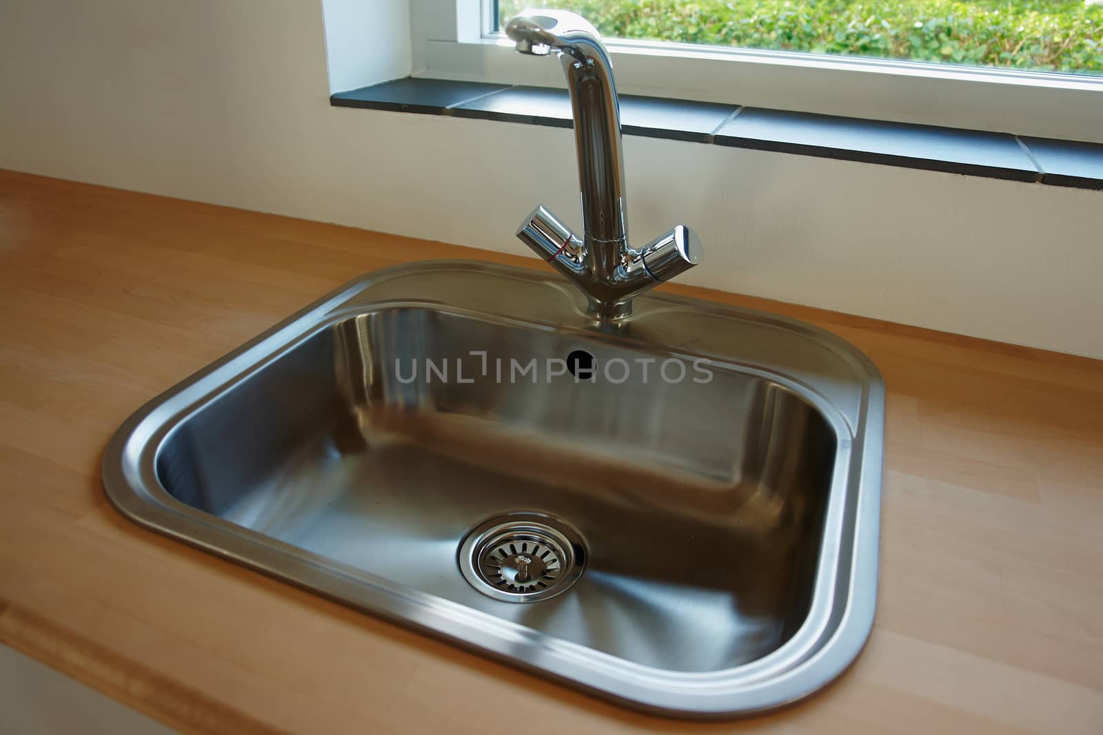 Details of modern design trendy  kitchen sink with water tap faucet                               