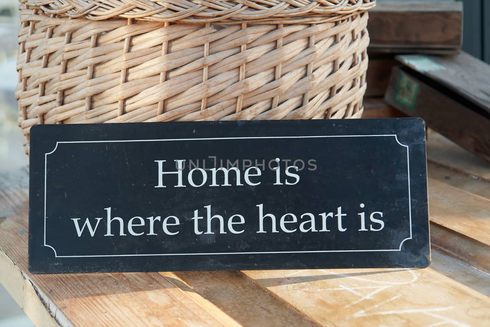 Home sweet home where the heart is text on a vintage metal sign                               