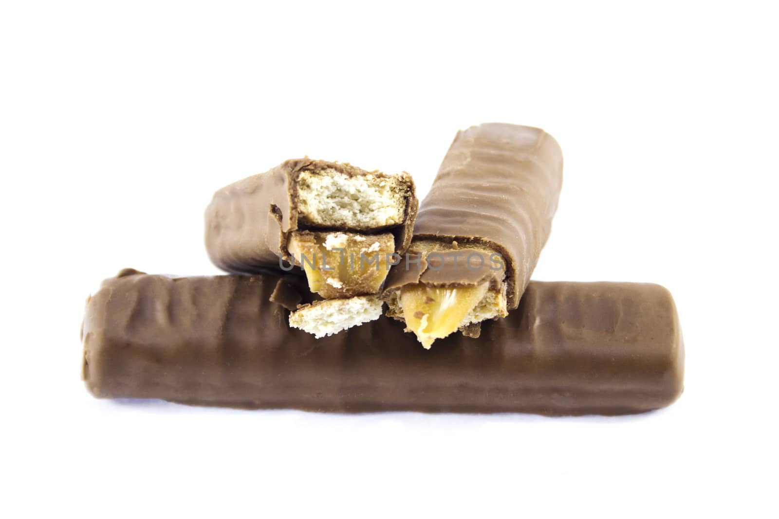 Closeup of chocolate bar with Caramel and Biscuit isolated on white.