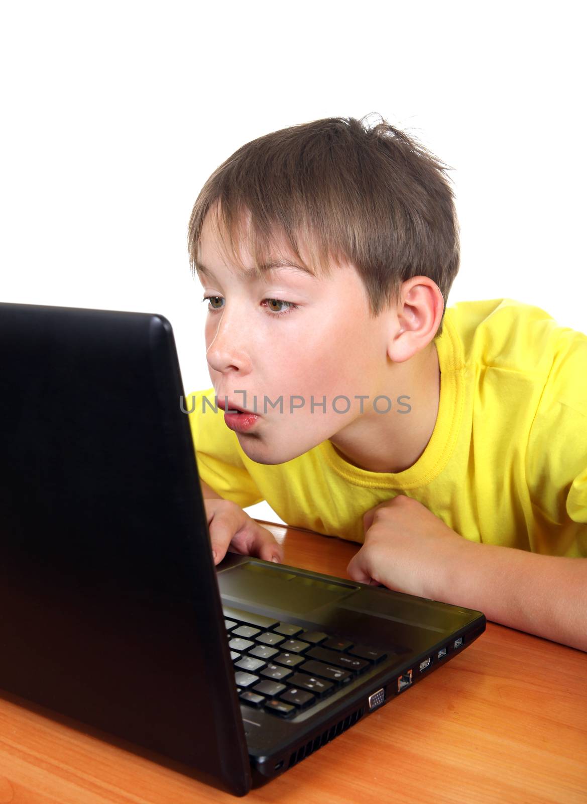 Surprised Kid with Laptop Isolated on the White Background
