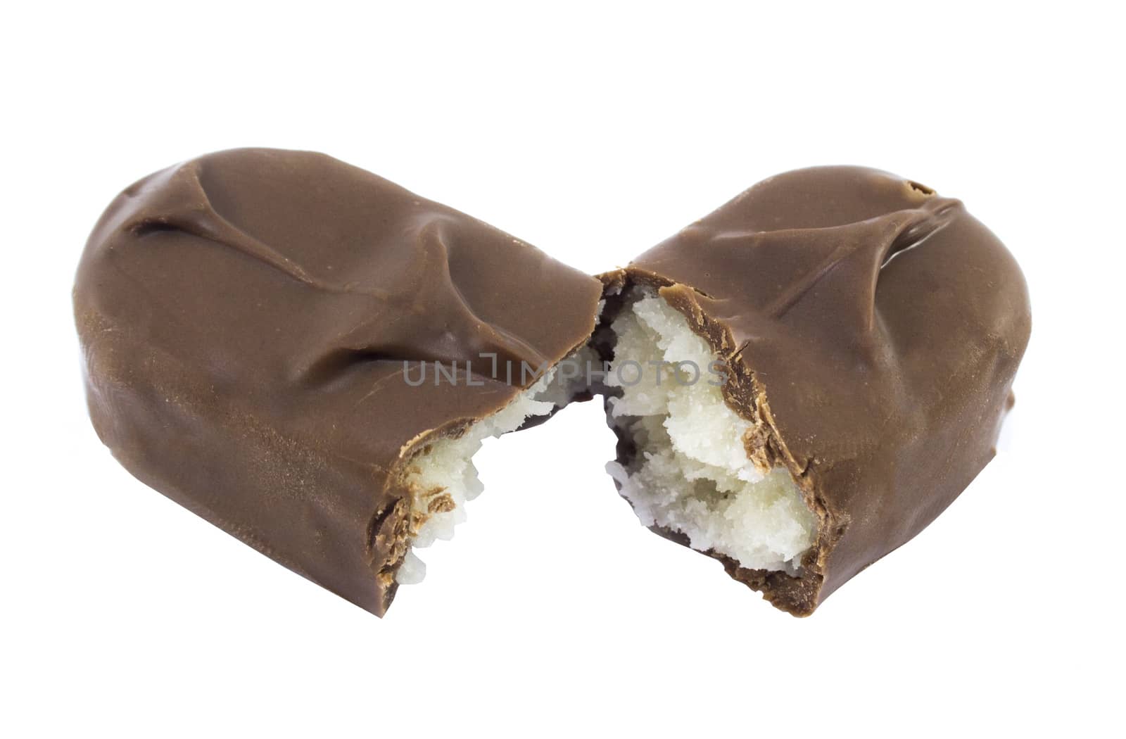 Closeup of chocolate bar with coconuts isolated on white.