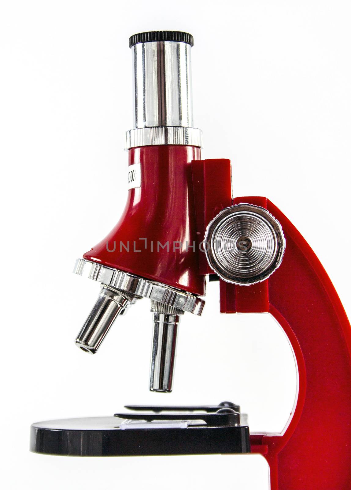 Modern red Microscope isolated on white background
