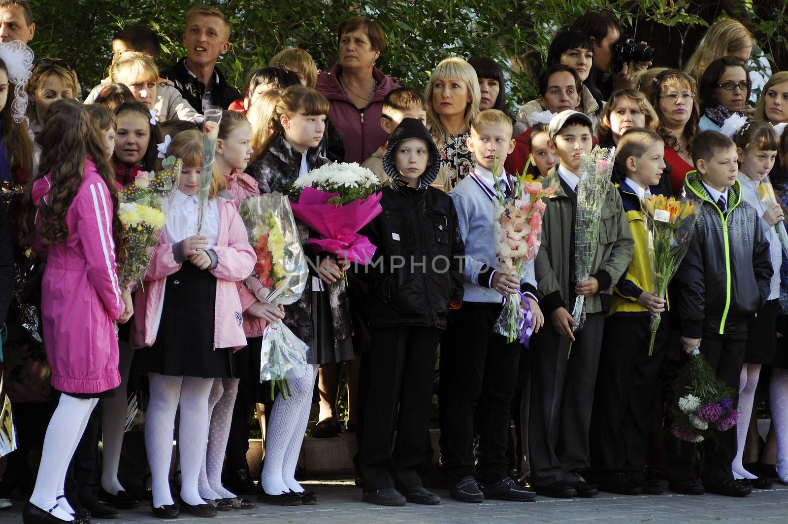 Pupils of elementary school on a solemn ruler on September 1 in the school yard