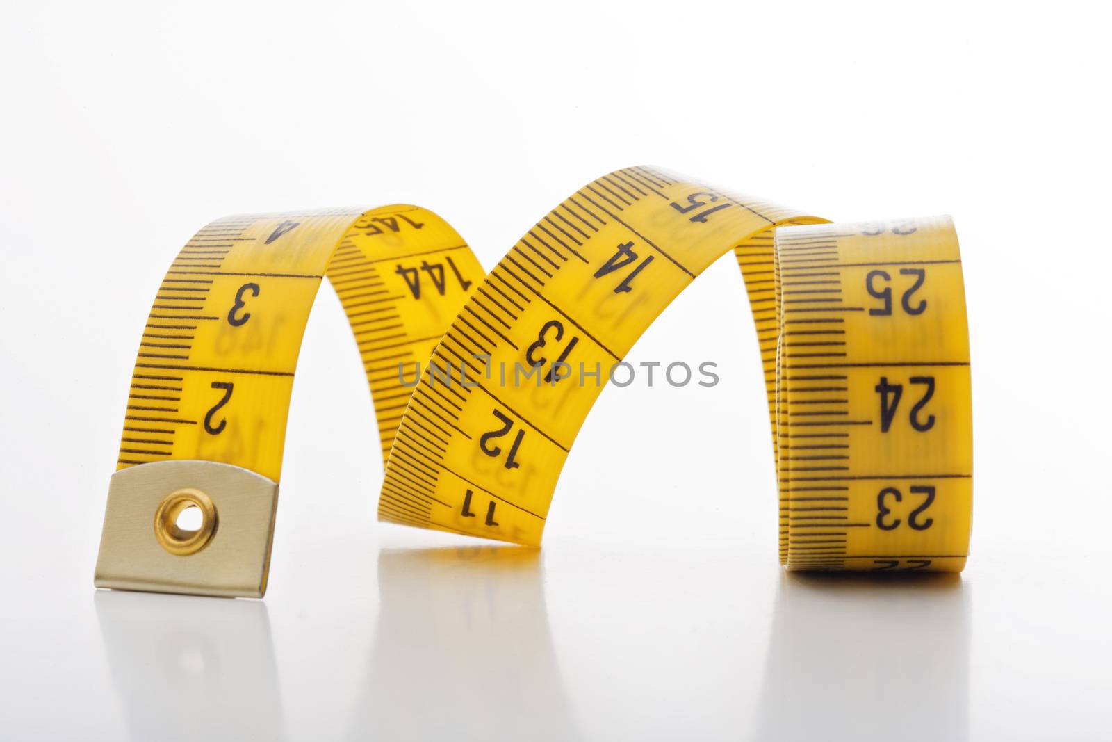 diet - yellow measuring tape isolated on white background