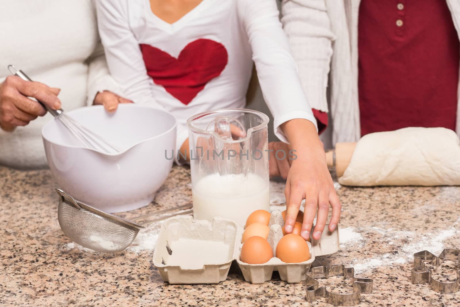 Multi-generation family baking together by Wavebreakmedia