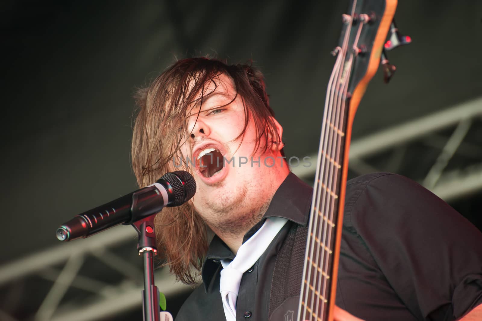 Yateley, UK - June 30, 2012: Carl Dawkins, crazy bassist with British rock band The Chilli Fighters performing at the GOTG Festival in Yateley, UK