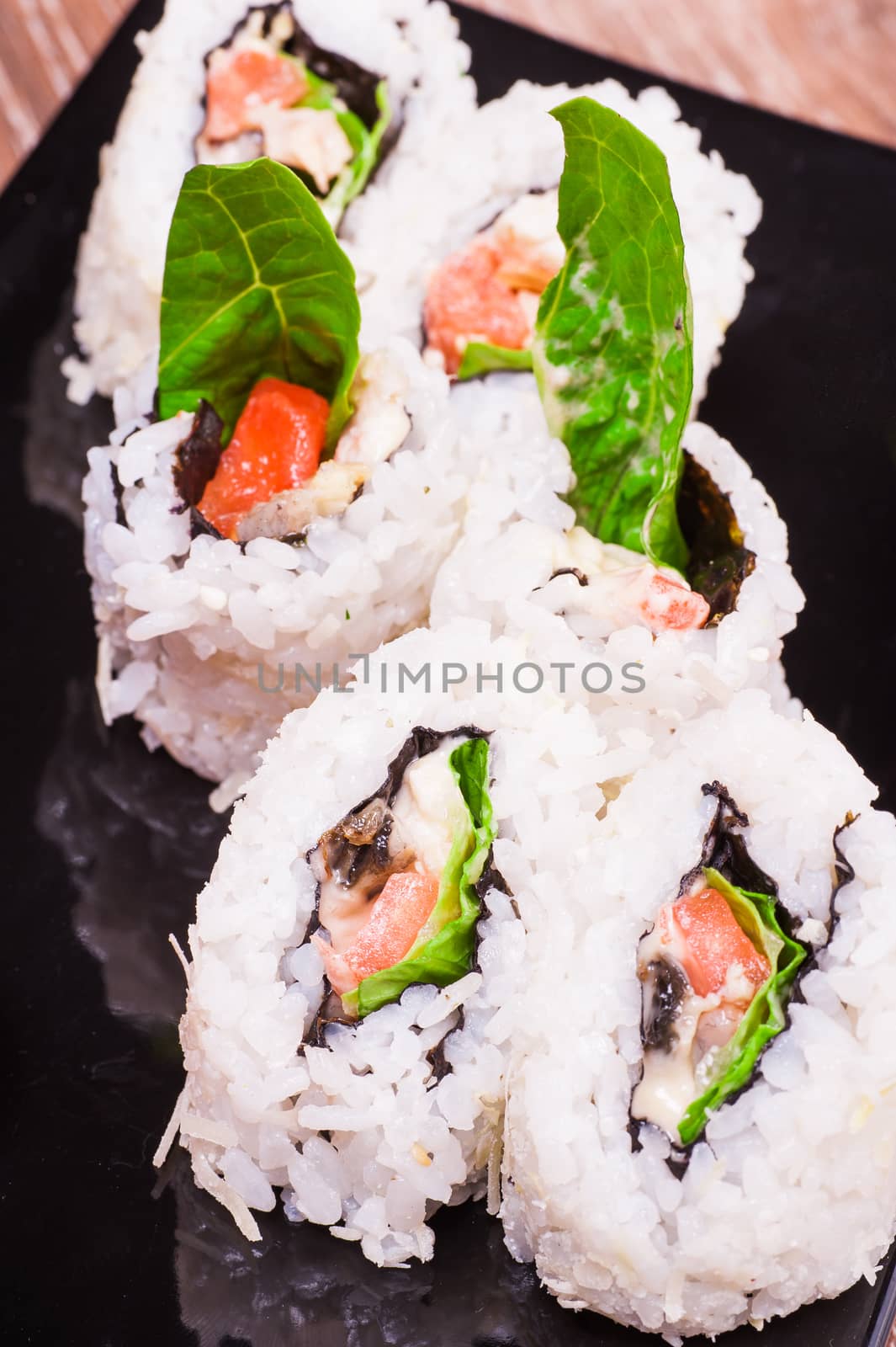 spicy sushi roll set  on wooden background