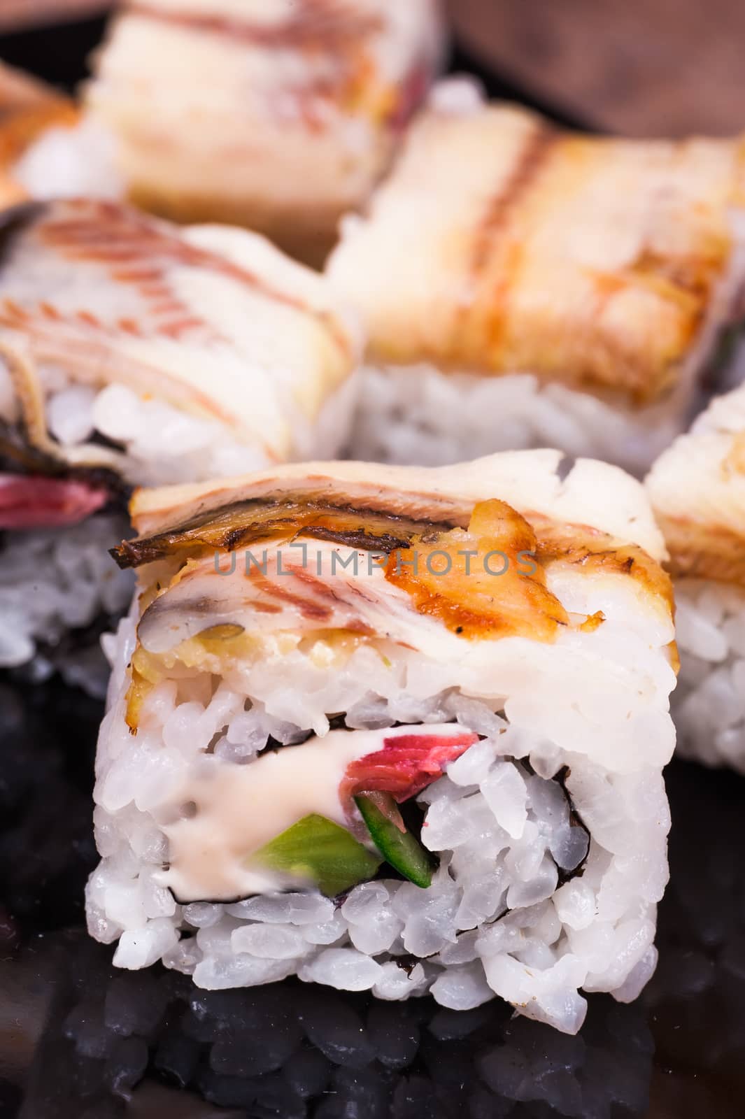 eel sushi roll set on wooden background 