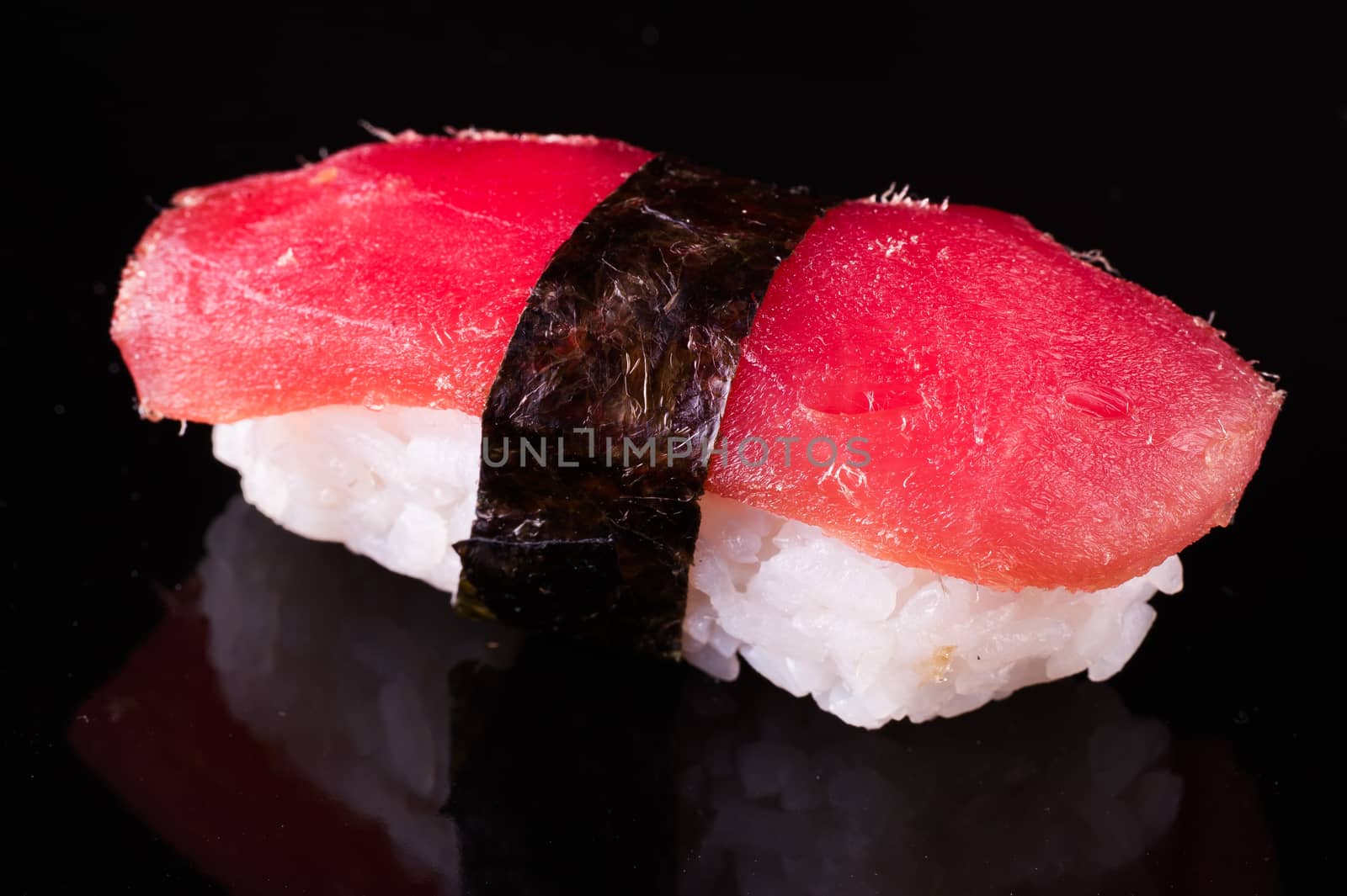 tuna nigiri Maguro isolated on black background