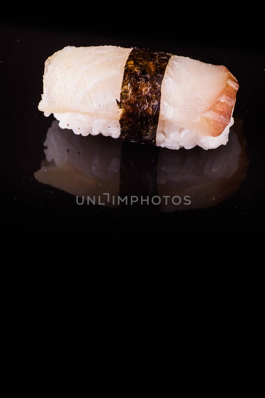 yellowtail hamachi  nigiri isolated on black background