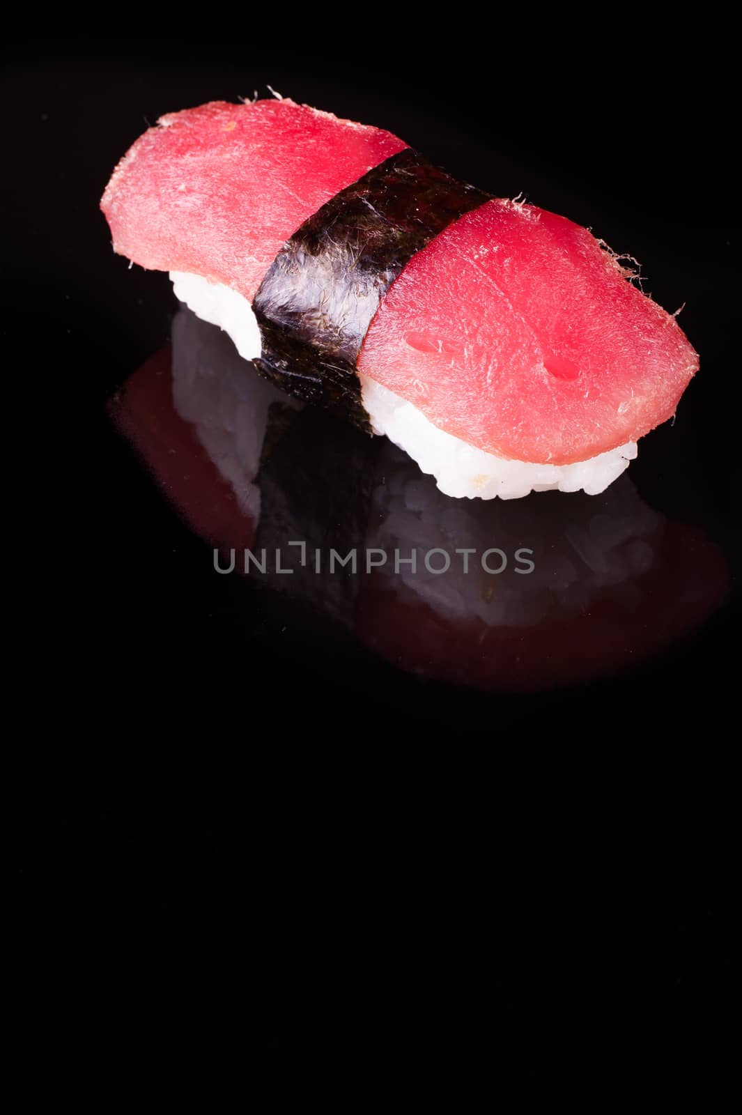 tuna nigiri Maguro isolated on black background