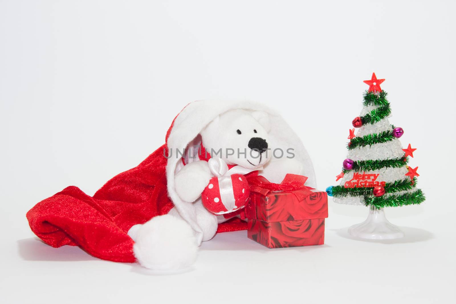 Santa Claus hat with christmas tree and gifts