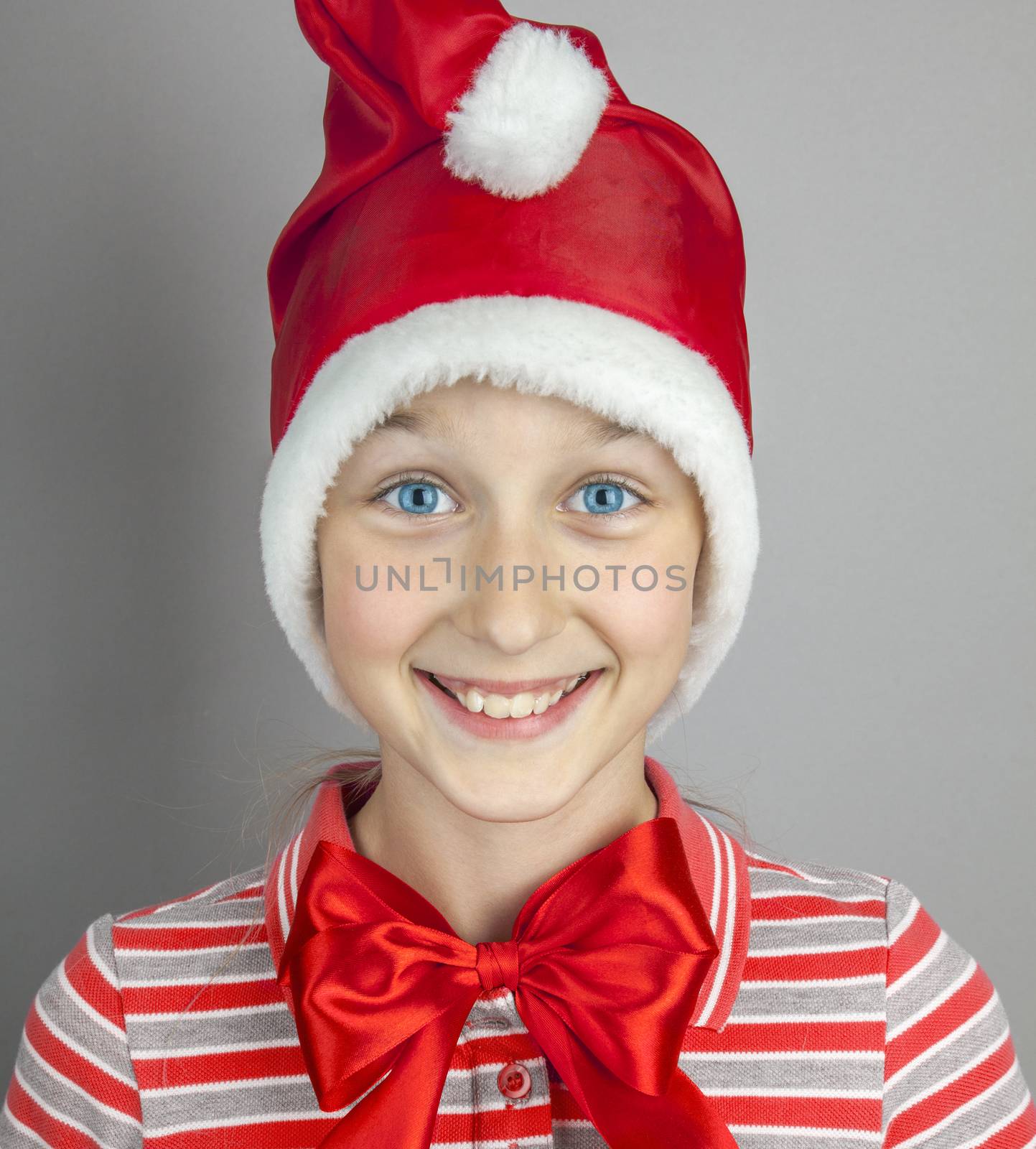 little girl in red santa hat