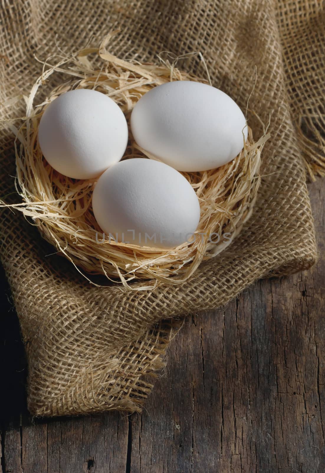 Fresh farm eggs on wooden background