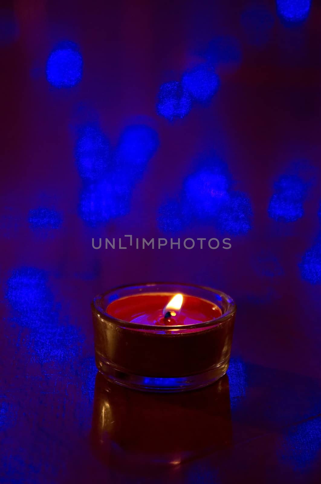 Orange candle on dark  background