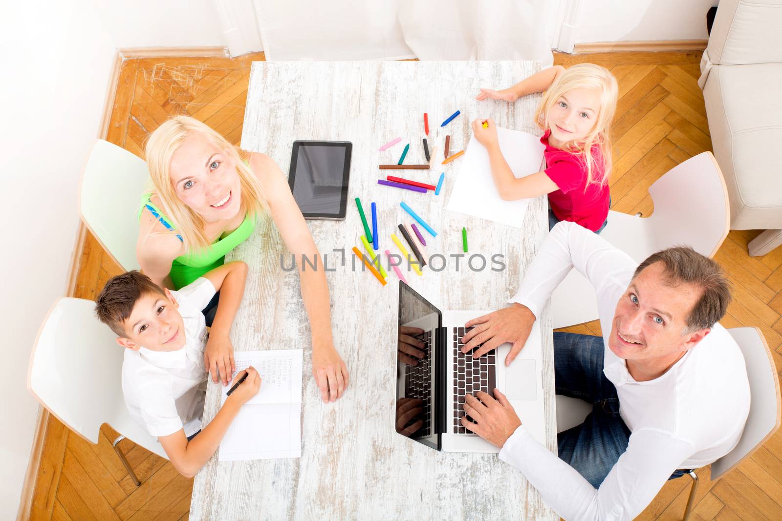 A family performing various activities at home.
