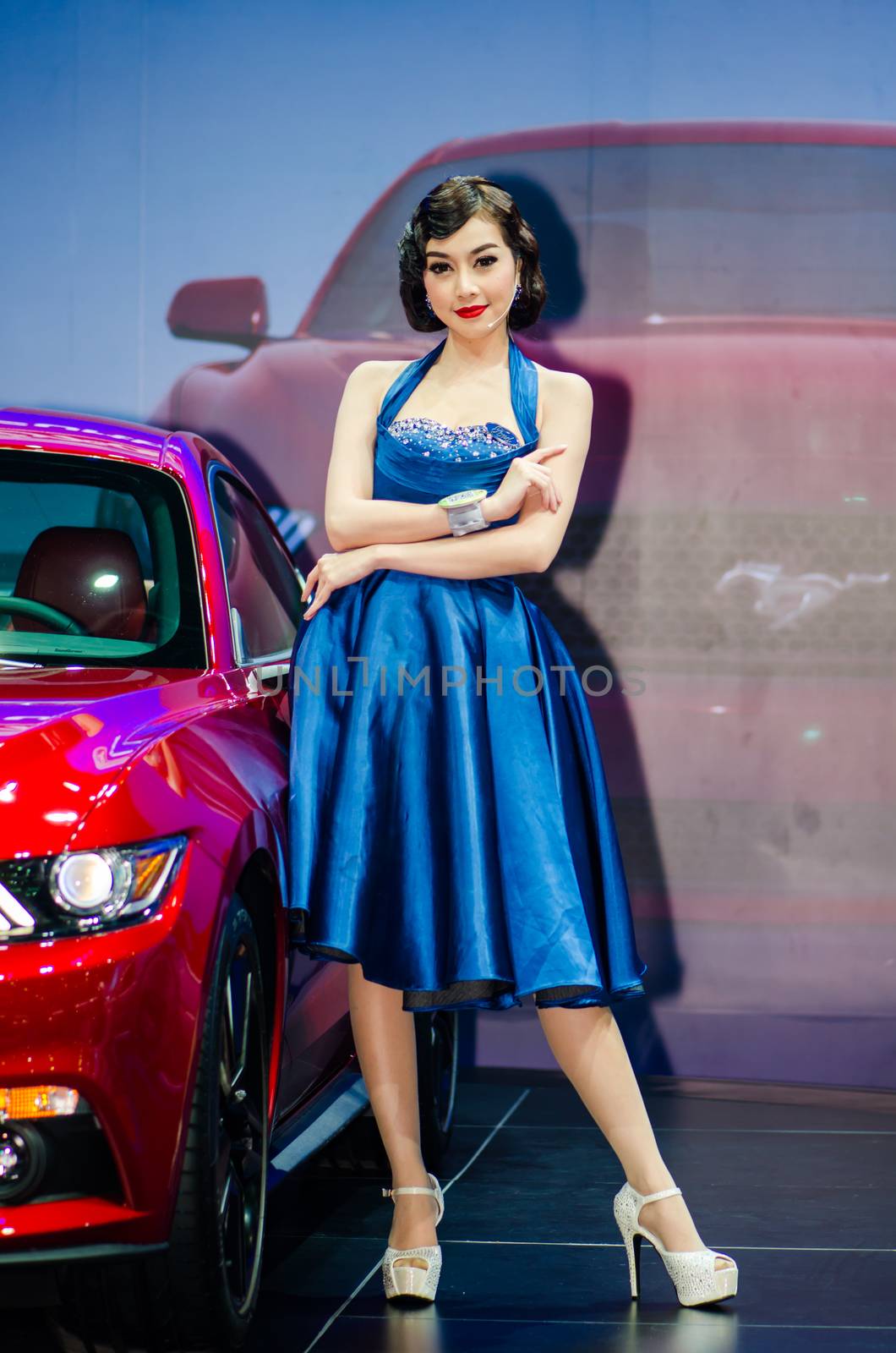 NONTHABURI - NOVEMBER 29: Ford Mustang car with unidentified model on display at Thailand International Motor Expo 2014 on November 29, 2014 in Nonthaburi, Thailand.