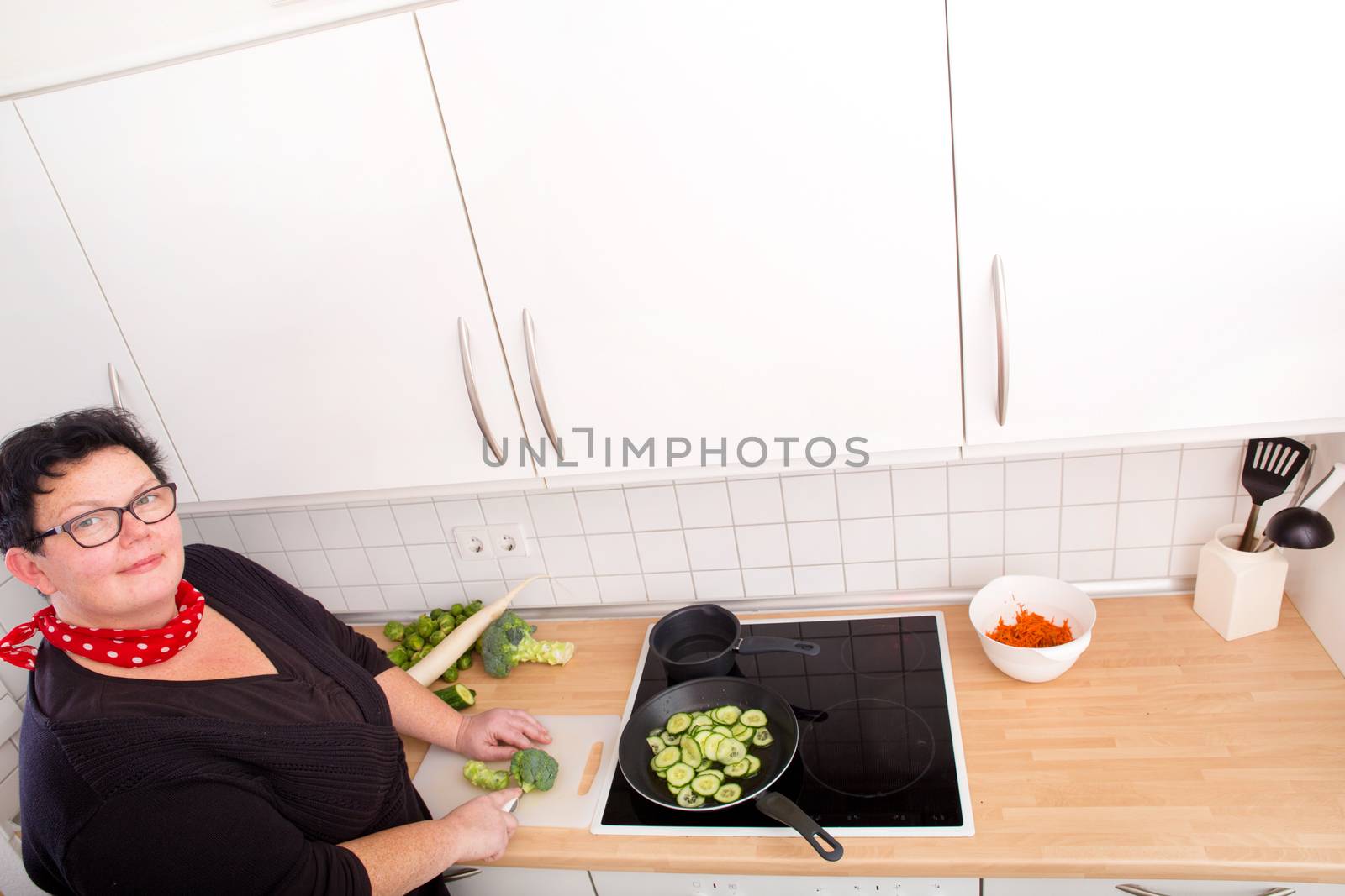 Woman cutting vegetables  by Spectral