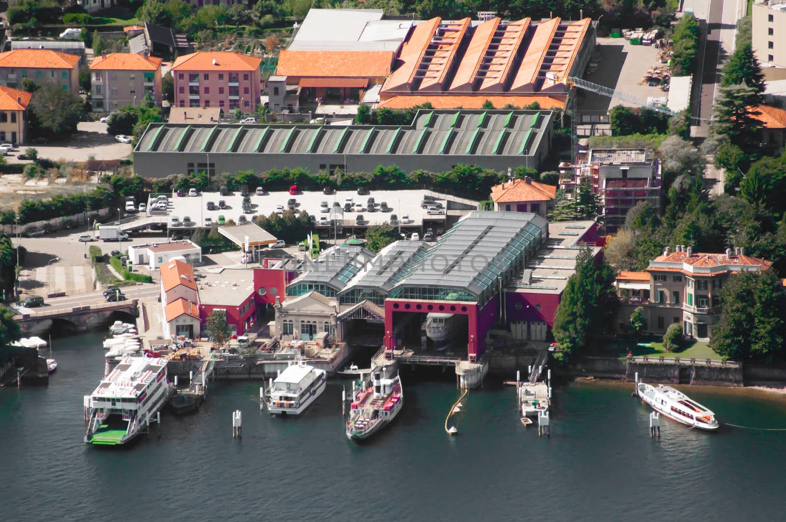 Ferries al docked at the harbour of the town called Como in Northern Italy. The name of the lake is also Como.