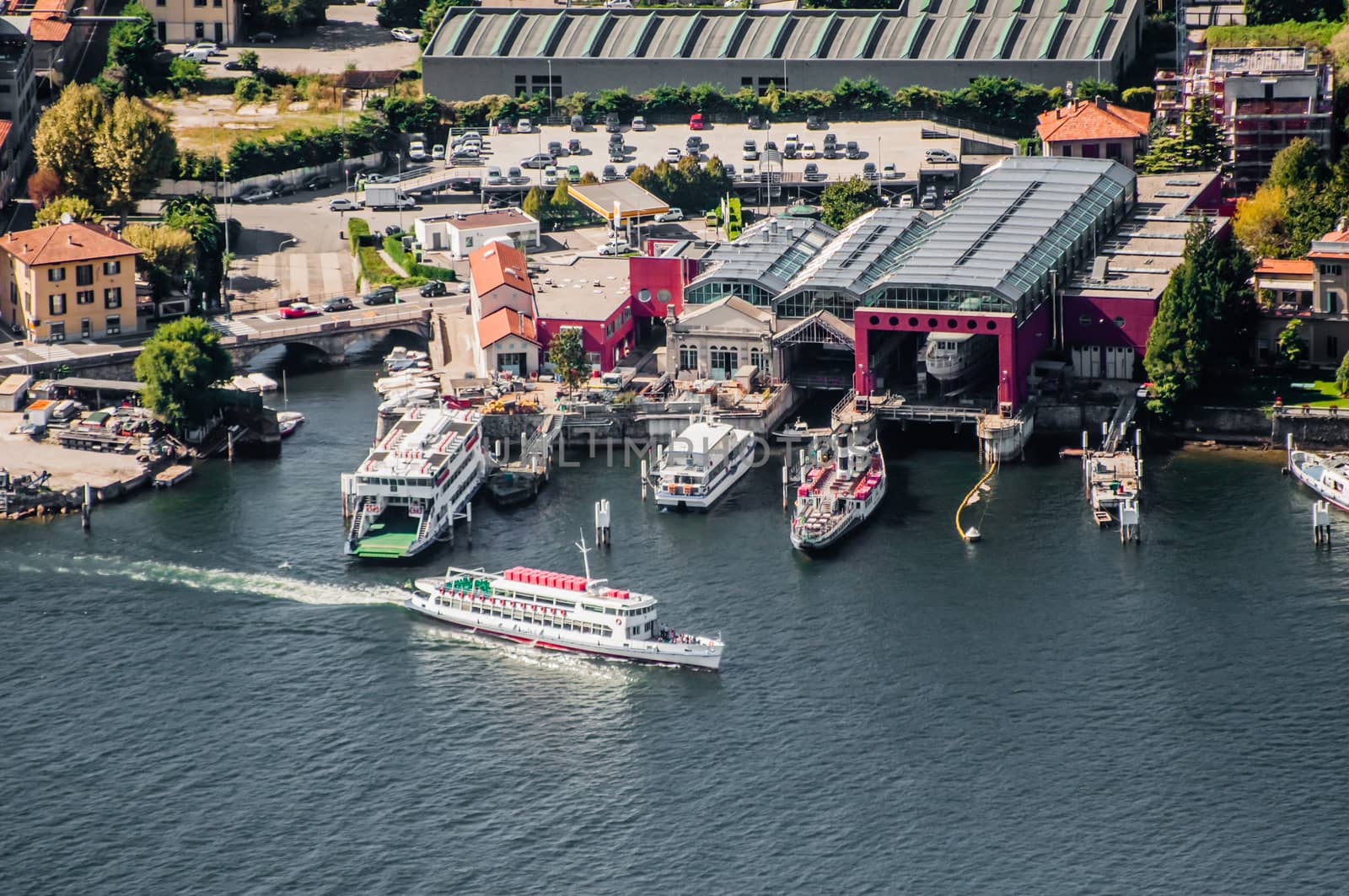 Ferry leaves from the harbour in lake Como at Como, Italy. Viewed from high above.