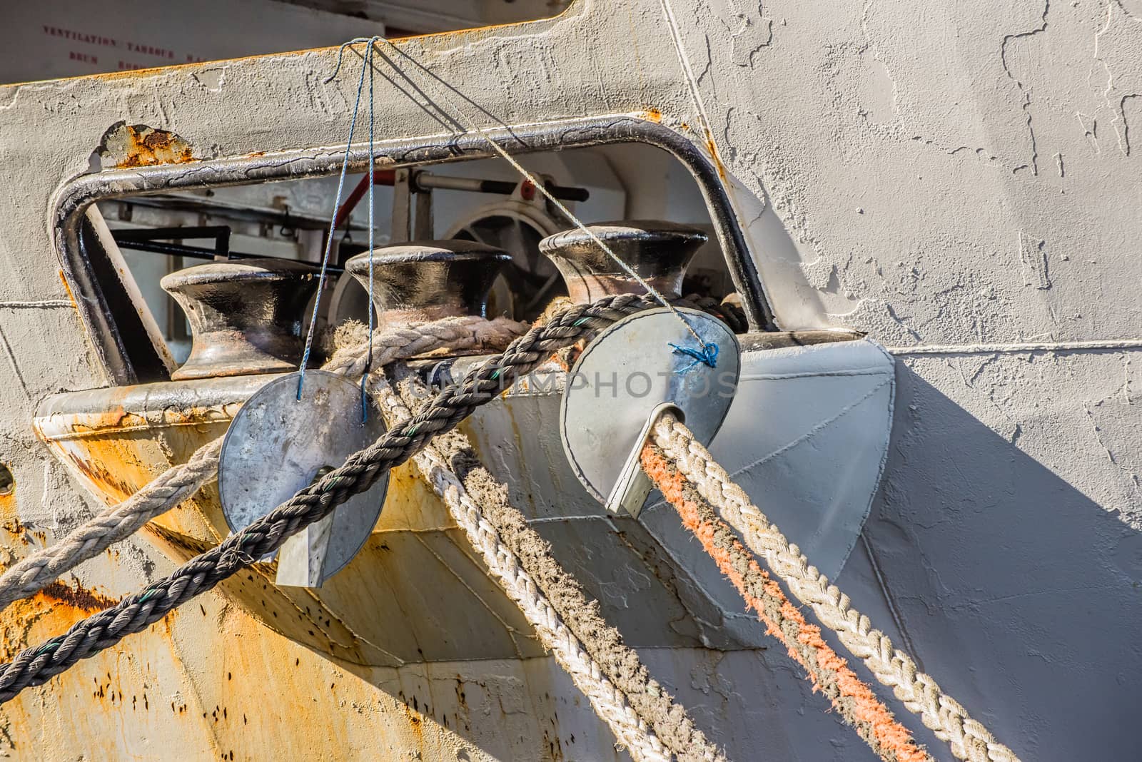 Capstans in an opening of the gunwale of a ship on the rope deck for the ropes to be secured while docking.