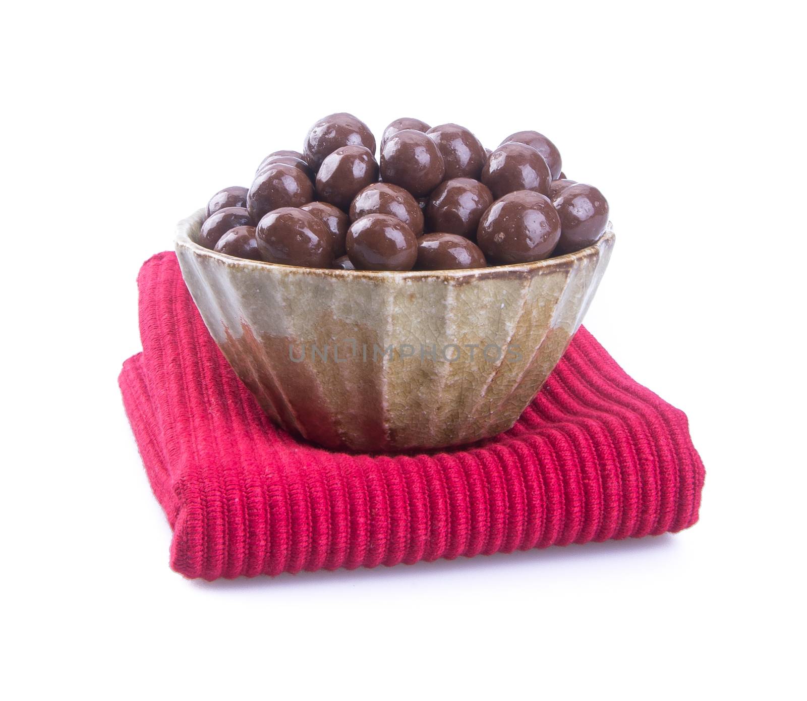 chocolate balls. chocolate balls in bowl on a background.