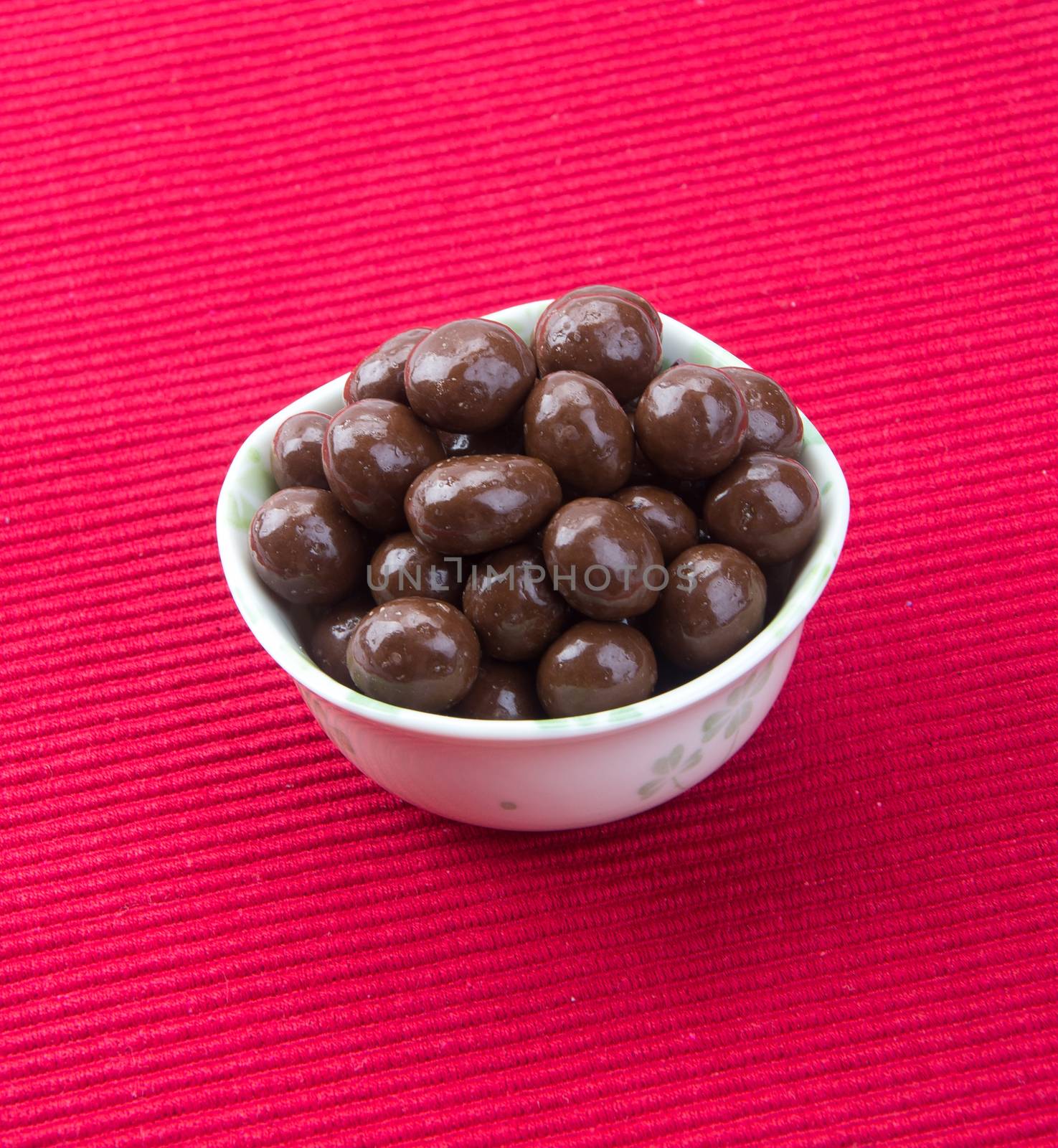 chocolate balls. chocolate balls in bowl on a background.