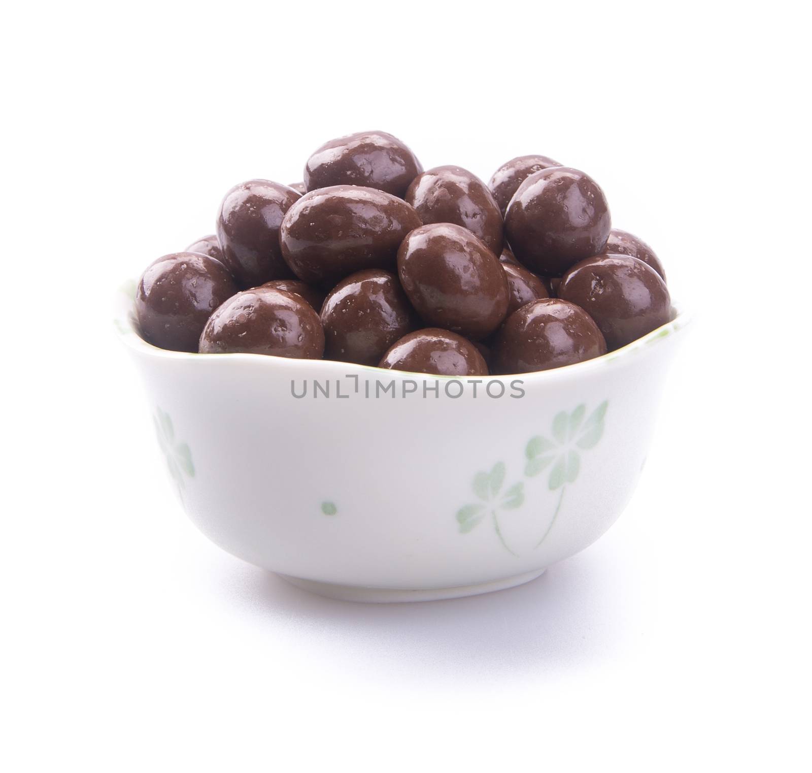 chocolate balls. chocolate balls in bowl on a background by heinteh