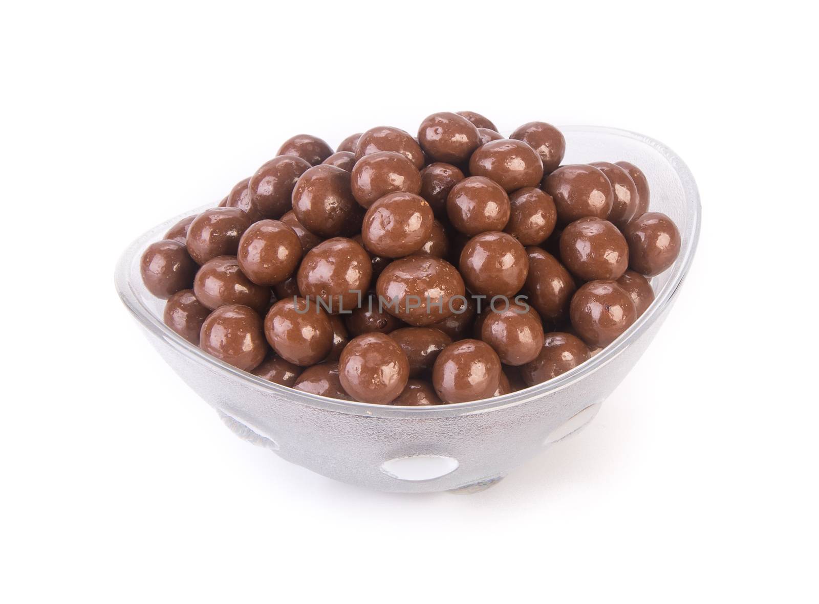 chocolate balls. chocolate balls in bowl on a background.