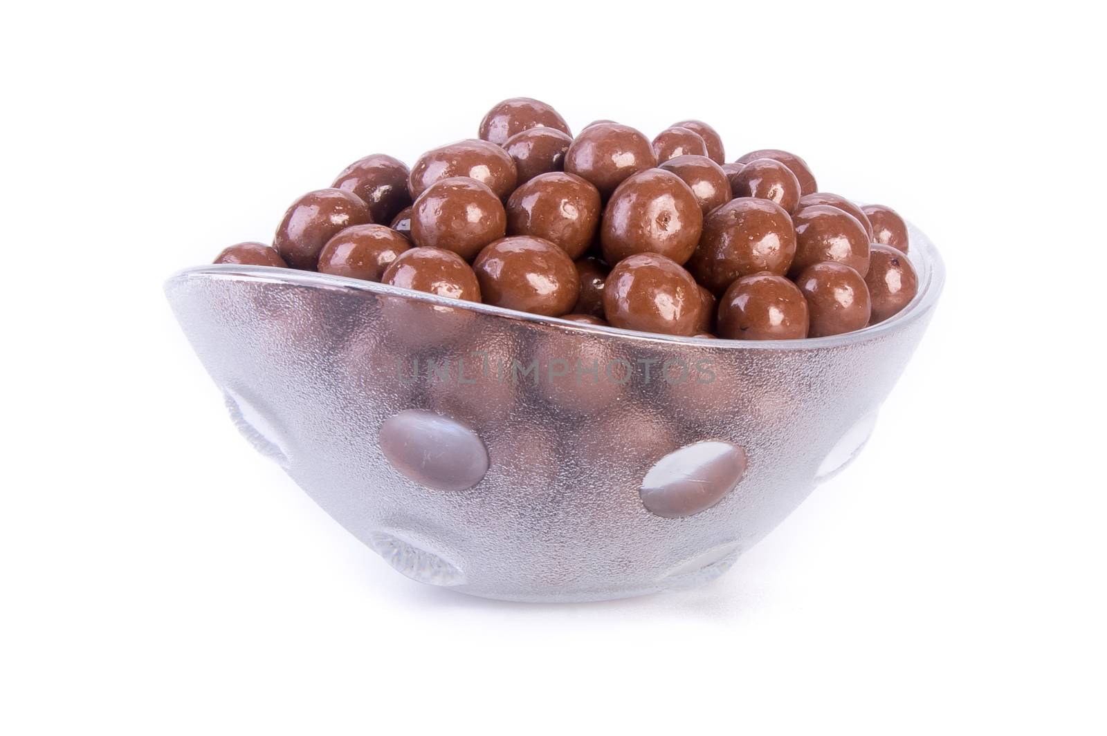chocolate balls. chocolate balls in bowl on a background.