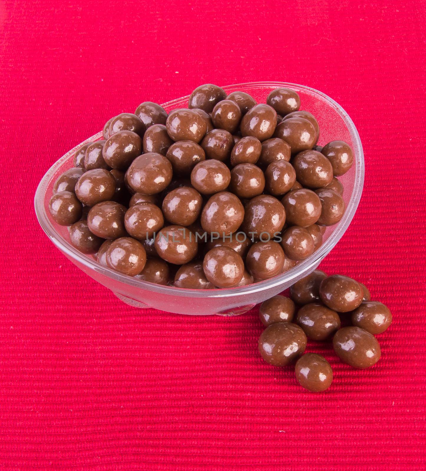 chocolate balls. chocolate balls in bowl on a background.