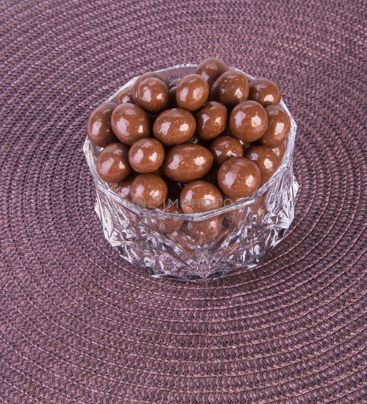 chocolate balls. chocolate balls in bowl on a background by heinteh