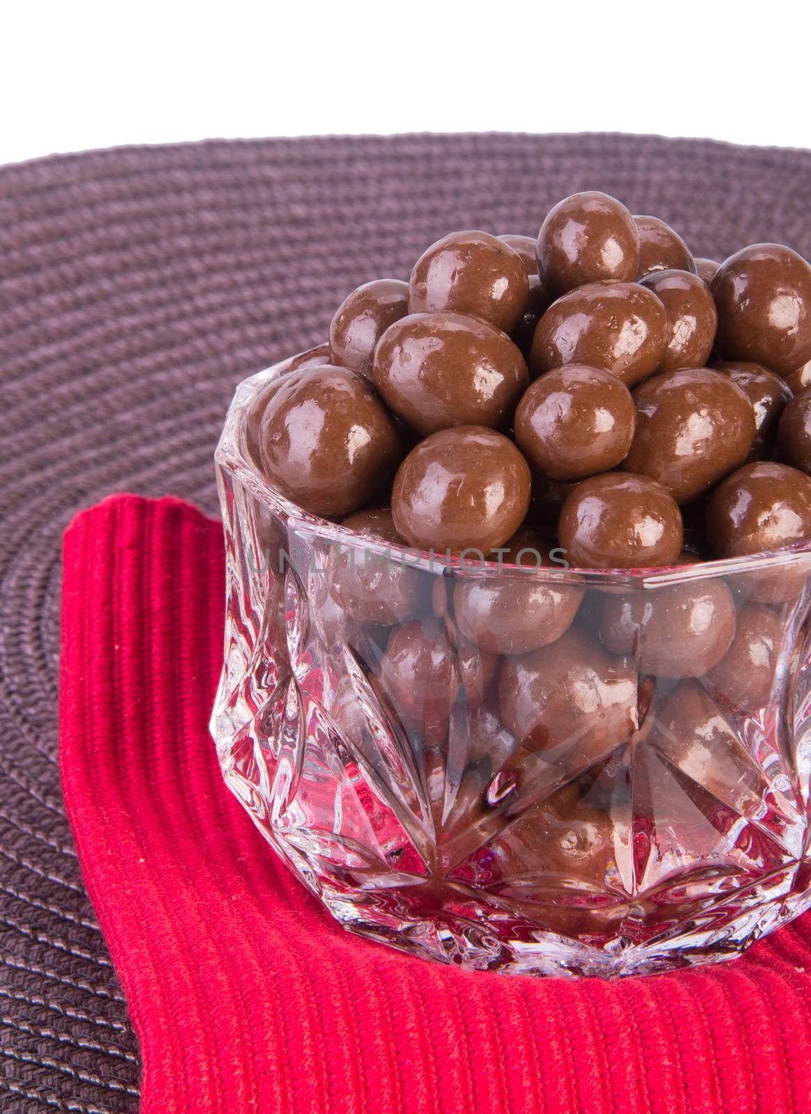 chocolate balls. chocolate balls in bowl on a background.