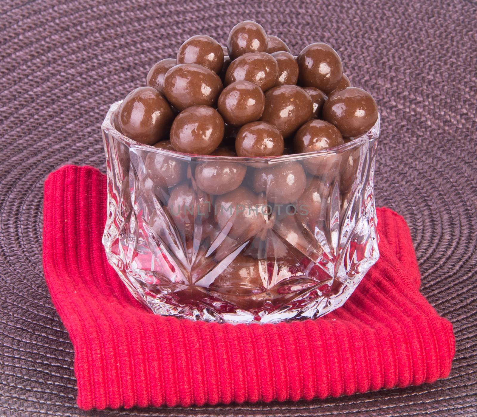 chocolate balls. chocolate balls in bowl on a background.