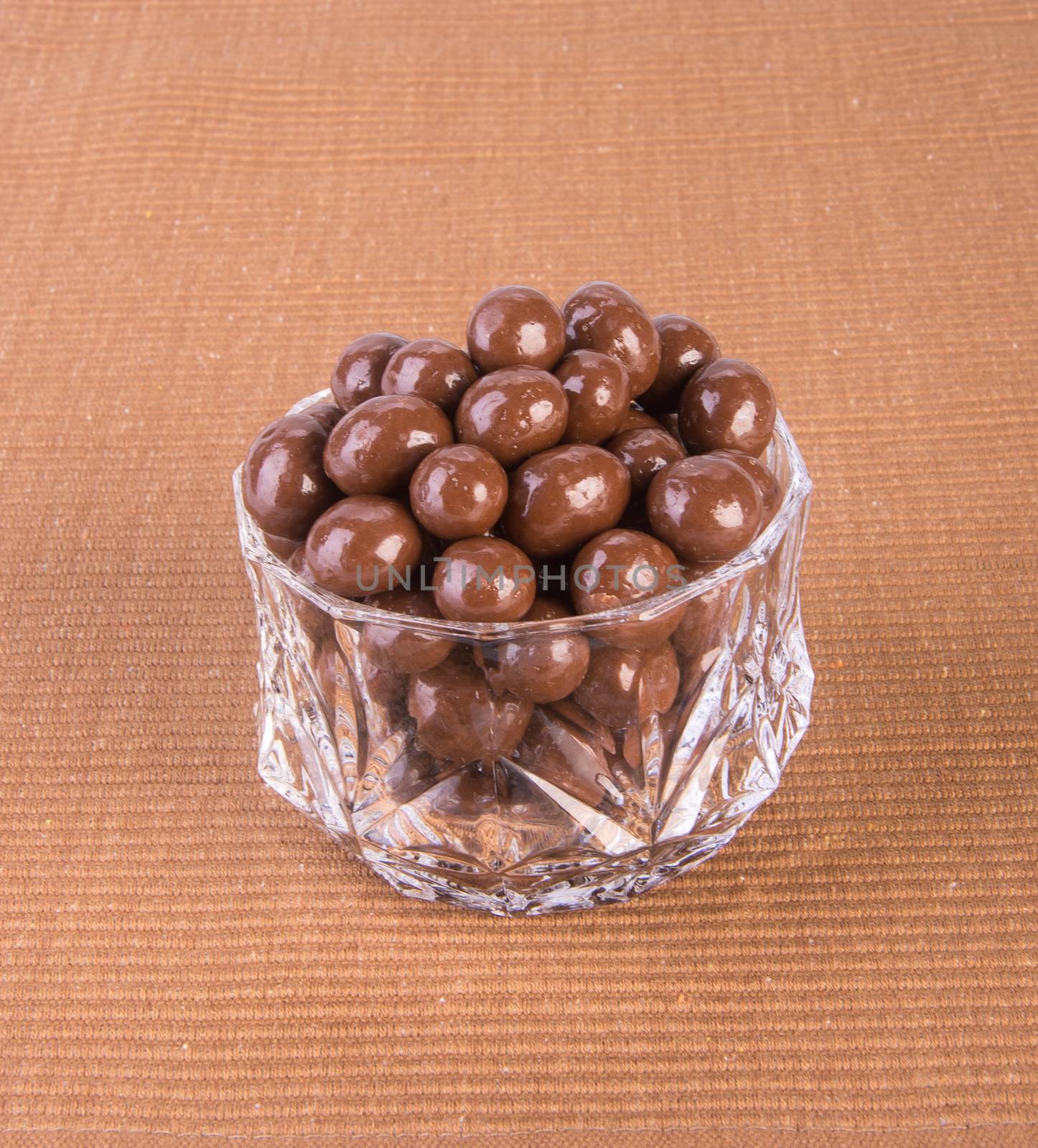 chocolate balls. chocolate balls in bowl on a background.