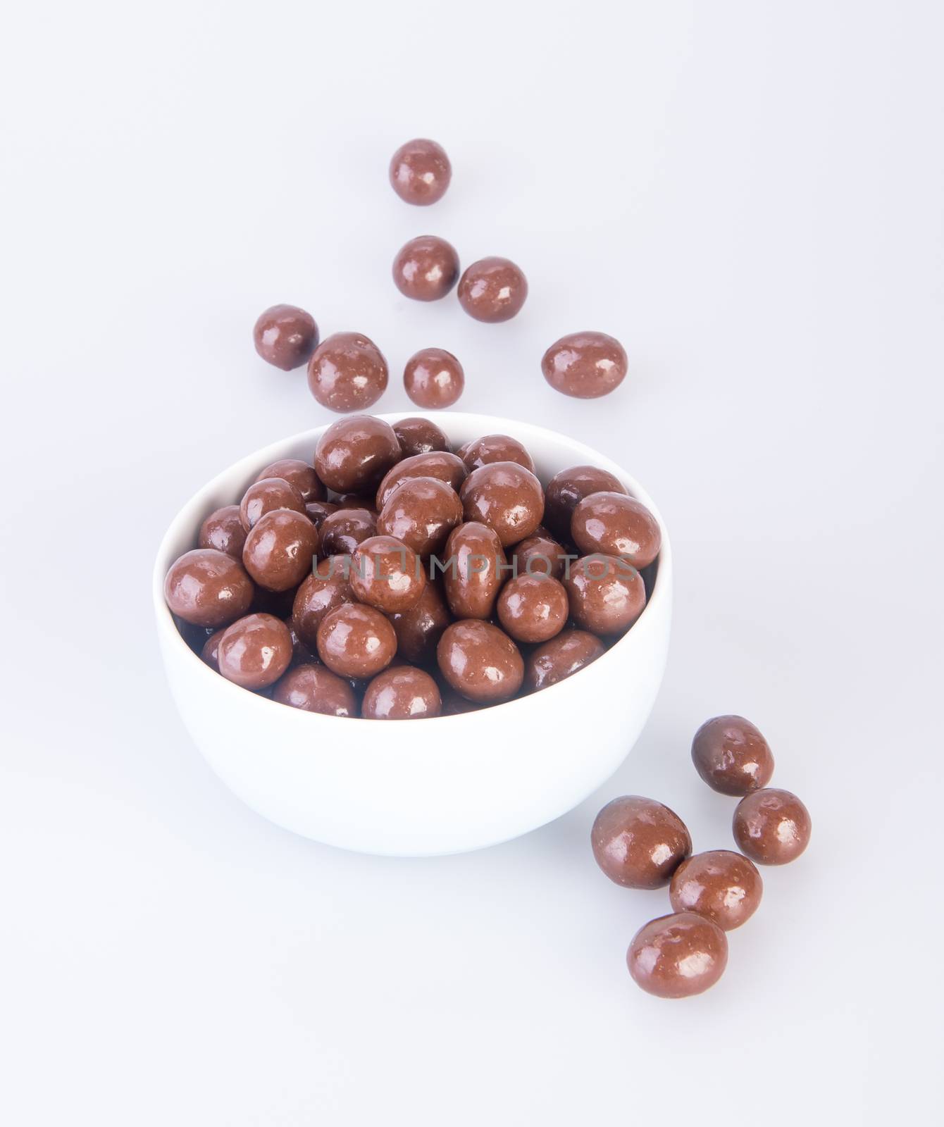 chocolate balls. chocolate balls in bowl on a background by heinteh