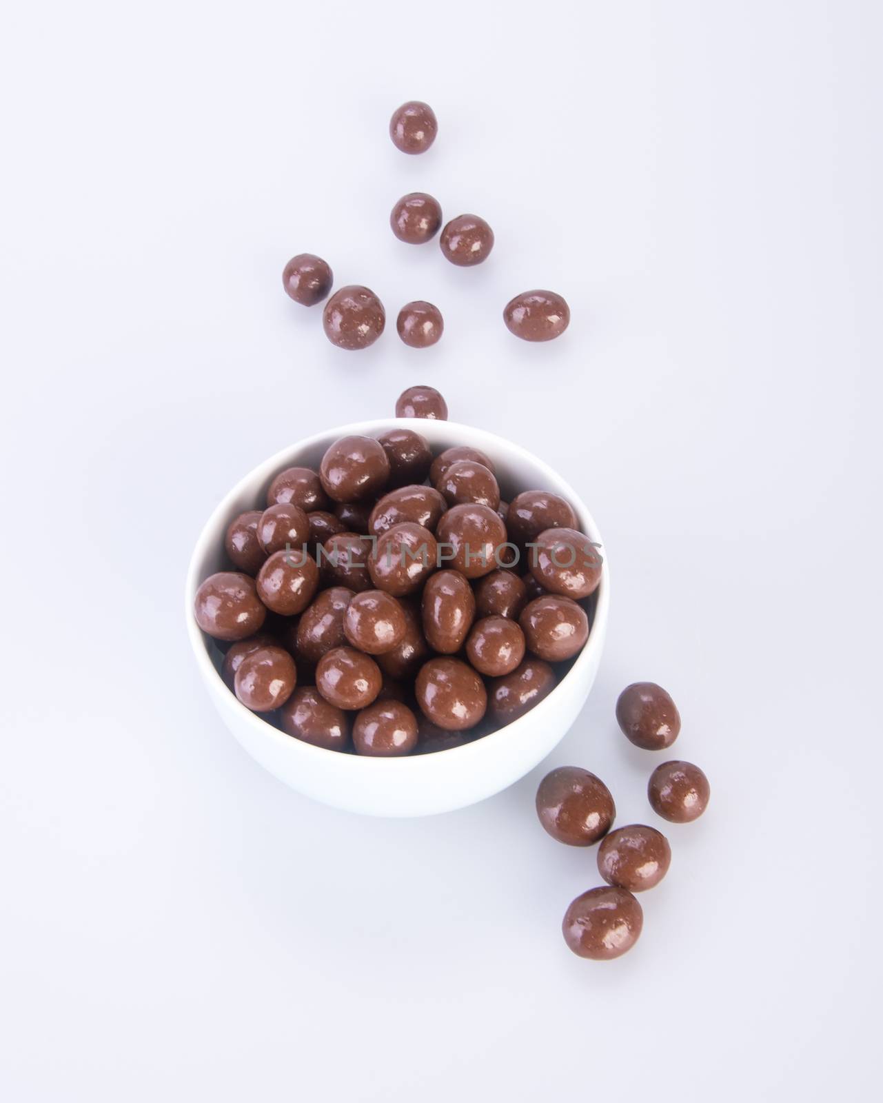 chocolate balls. chocolate balls in bowl on a background.