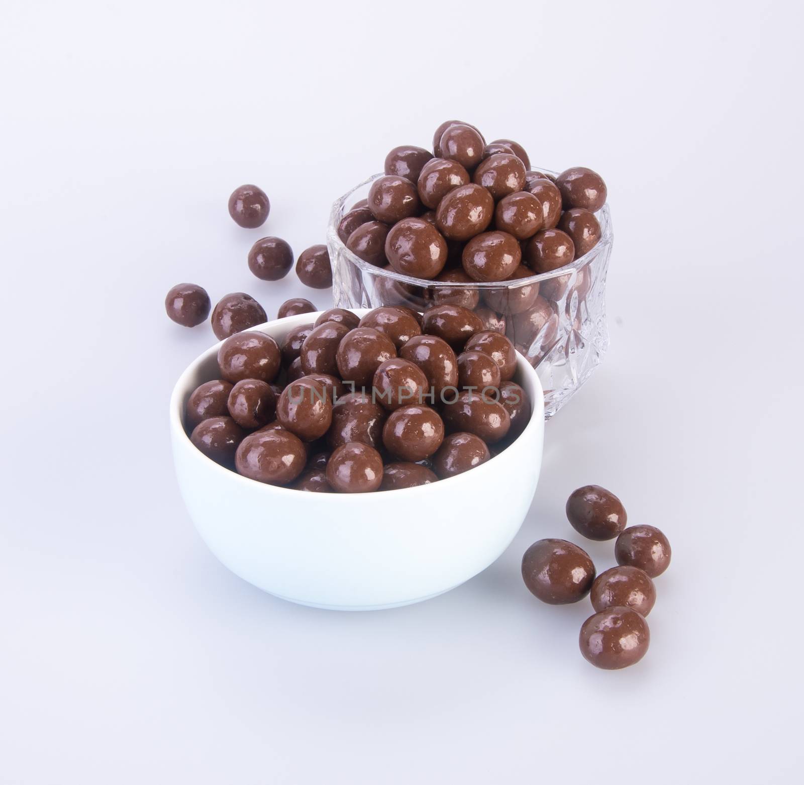 chocolate balls. chocolate balls in bowl on a background.